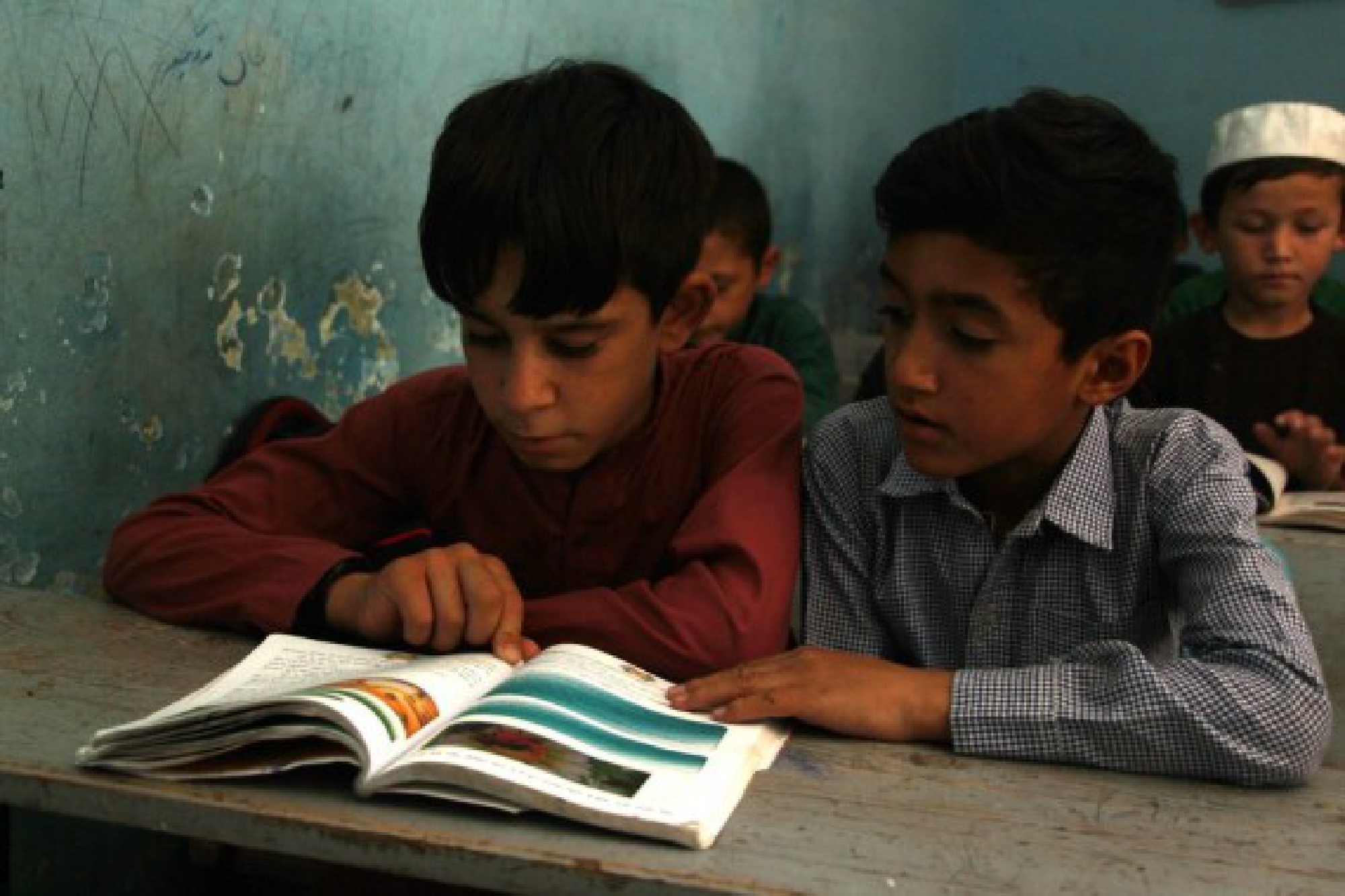 Afghan school students attend a classroom at a local school after the Taliban have taken control of the country in Kunduz province, Afghanistan, Aug. 22, 2021.