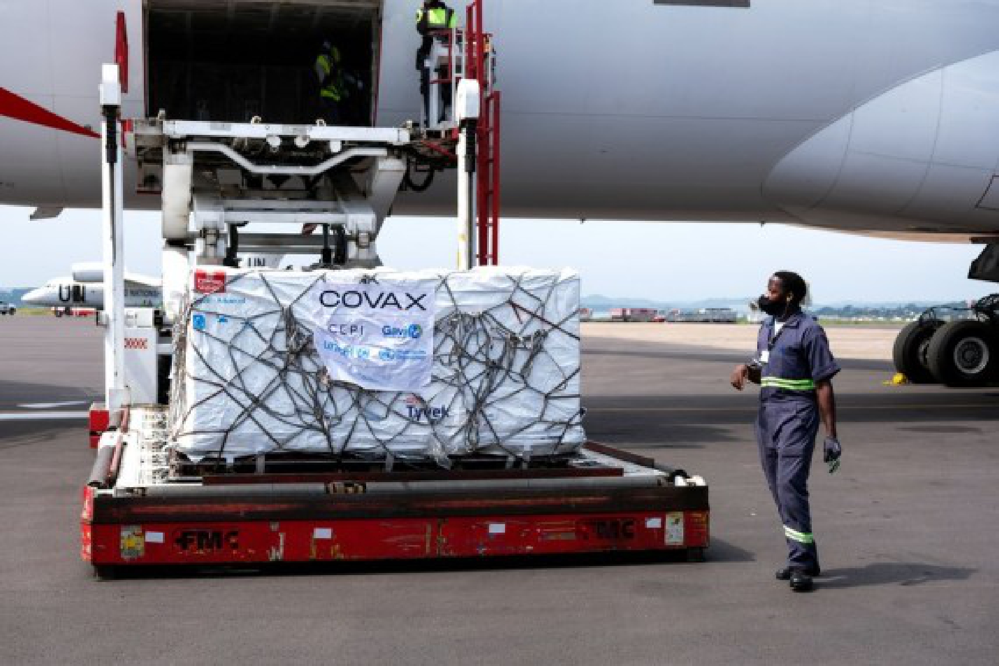 Photo taken on March 5, 2021 shows AstraZeneca-Oxford vaccines from COVAX vaccine sharing program being unloaded from a plane at Entebbe International Airport, Uganda.