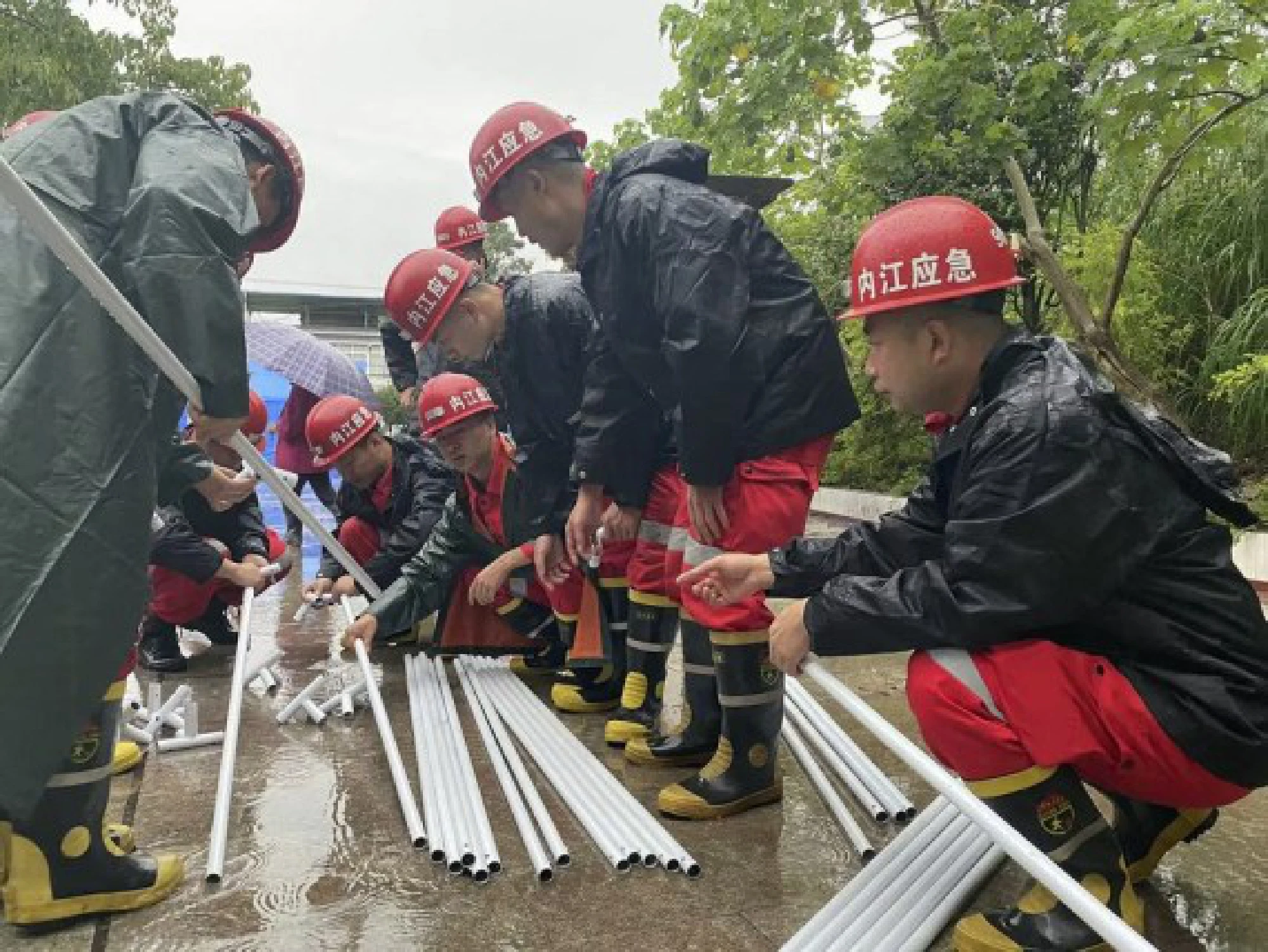 Rescuers prepare to set up tents in Fuji Town of Luxian County, southwest China's Sichuan Province, Sept. 16, 2021.  