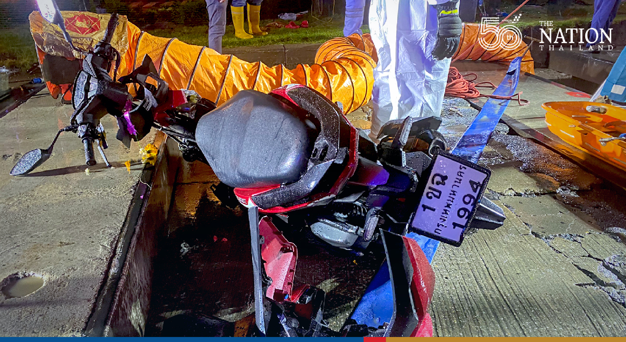 Motorcycle rider plunges 6 metres down hole in Bangkok