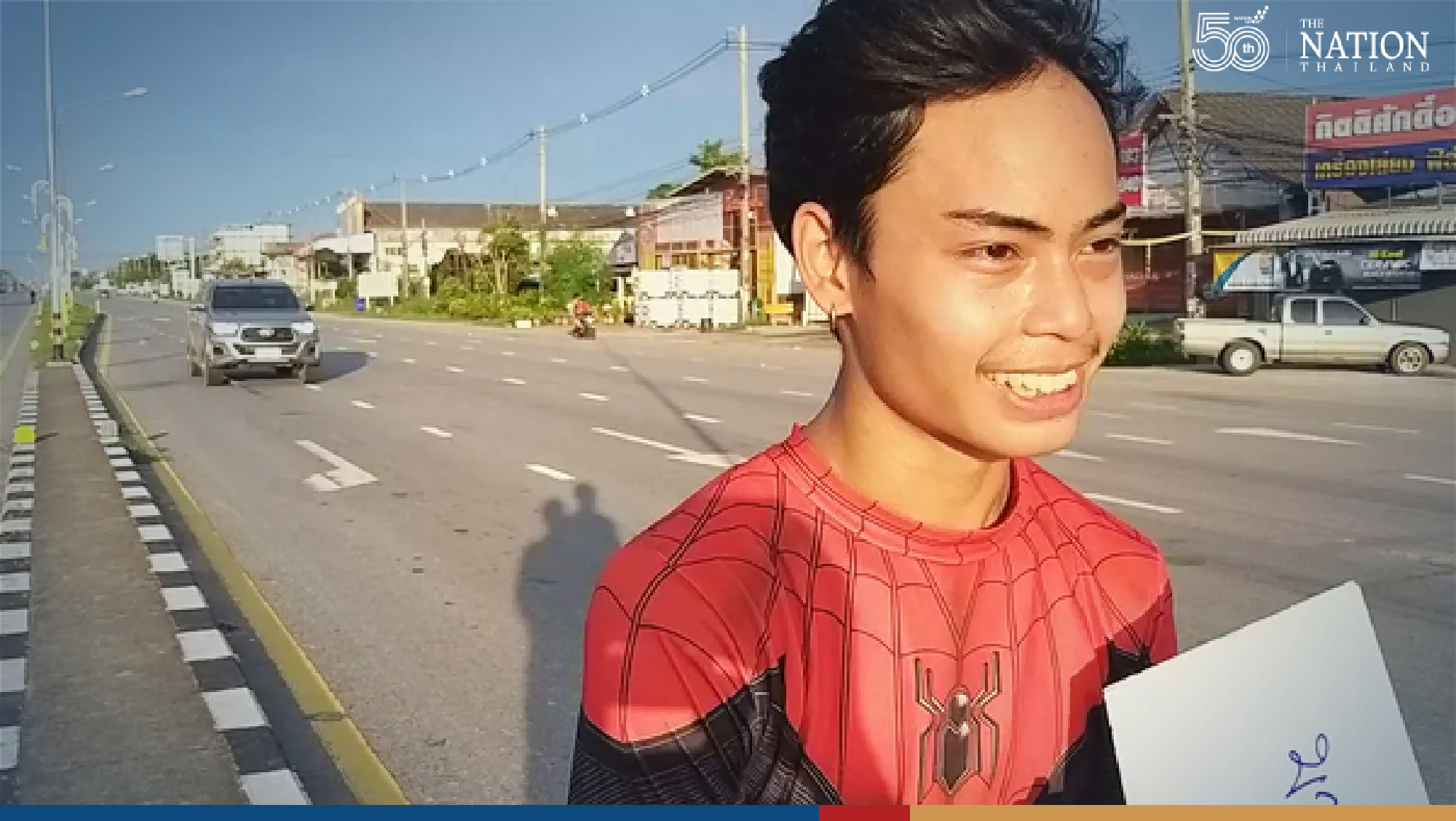 ‘Spider-Man’ swoops on busy junction to net college funds