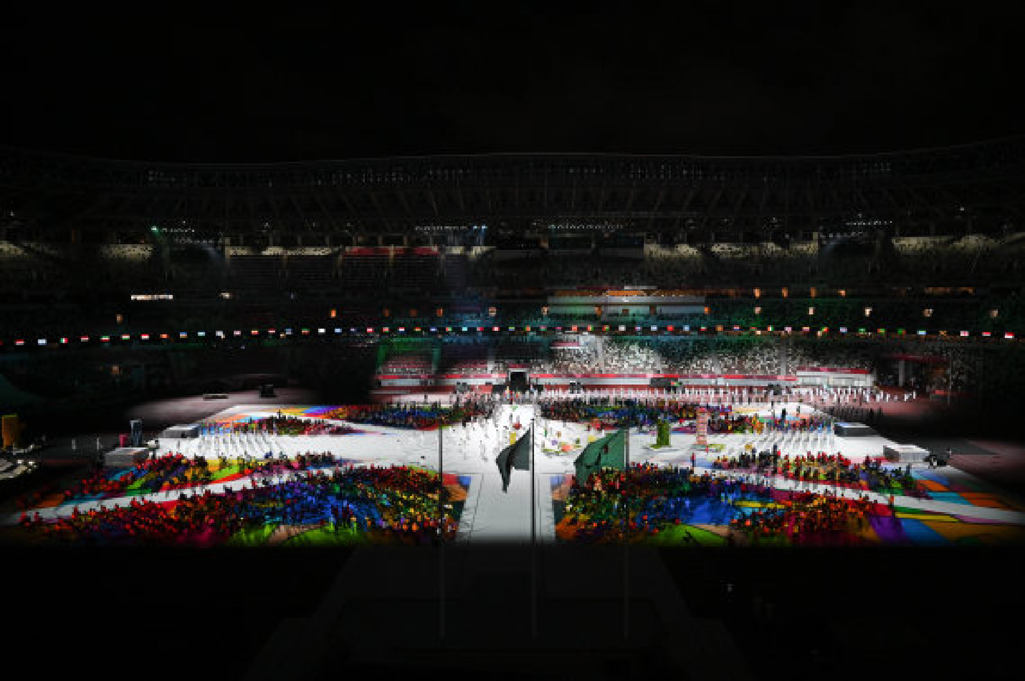 Flagbearers enter the Olympic Stadium during the closing ceremony of the Tokyo 2020 Paralympic Games in Tokyo, Japan, Sept. 5, 2021.