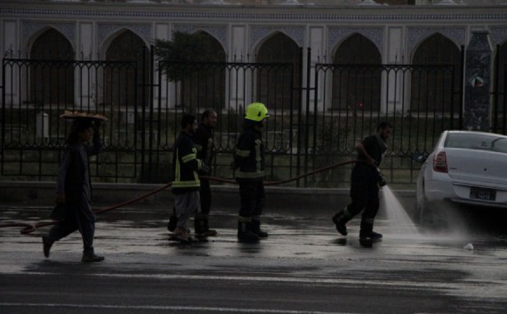 Afghan firefighters clean the site of a blast in Kabul, capital of Afghanistan, Oct. 3, 2021. (Photo by Saifurahman Safi/Xinhua)