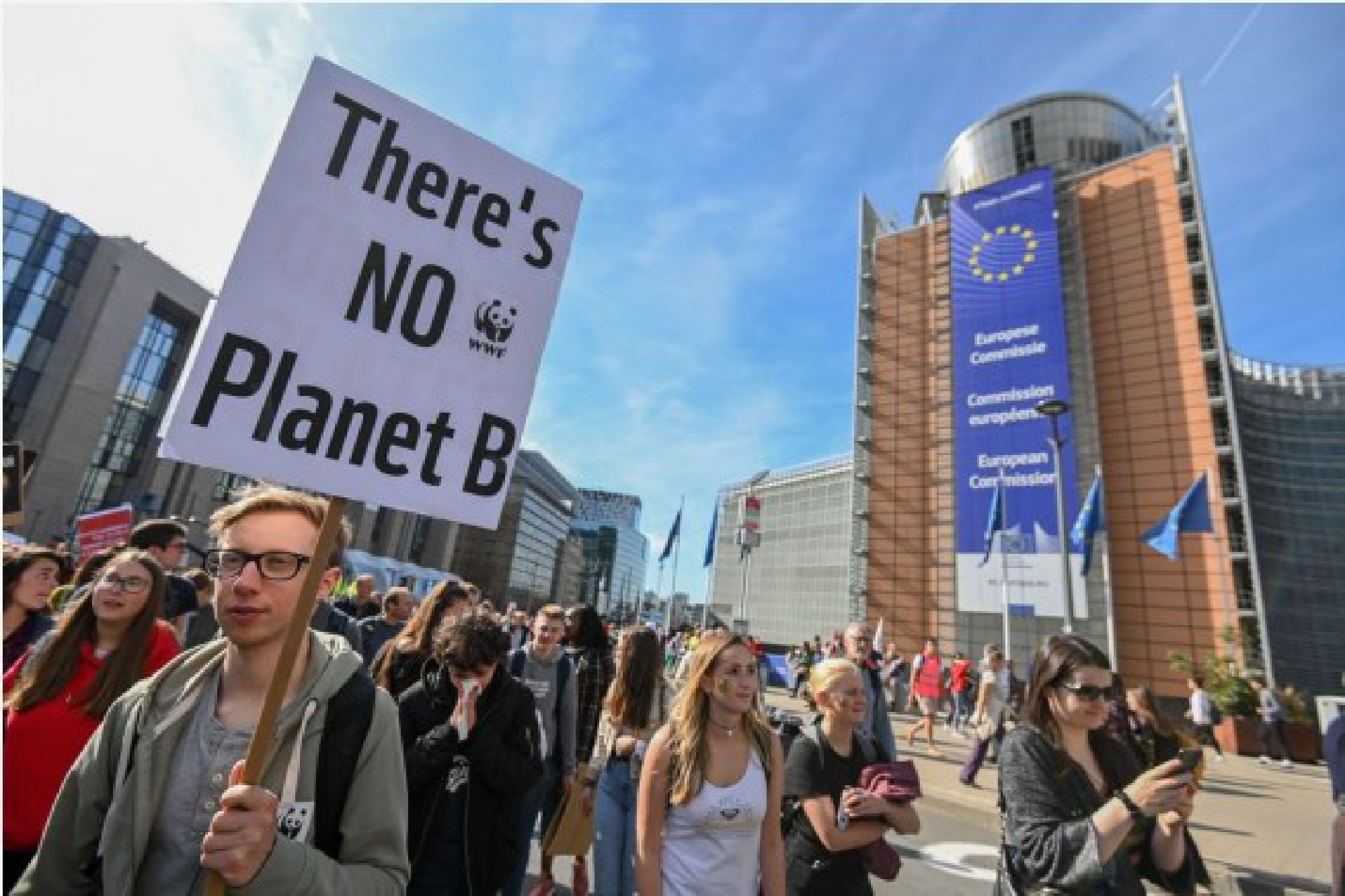 People participate in a march calling for action against climate change in Brussels, Belgium, Sept. 20, 2019. (Photo by Riccardo Pareggiani/Xinhua)