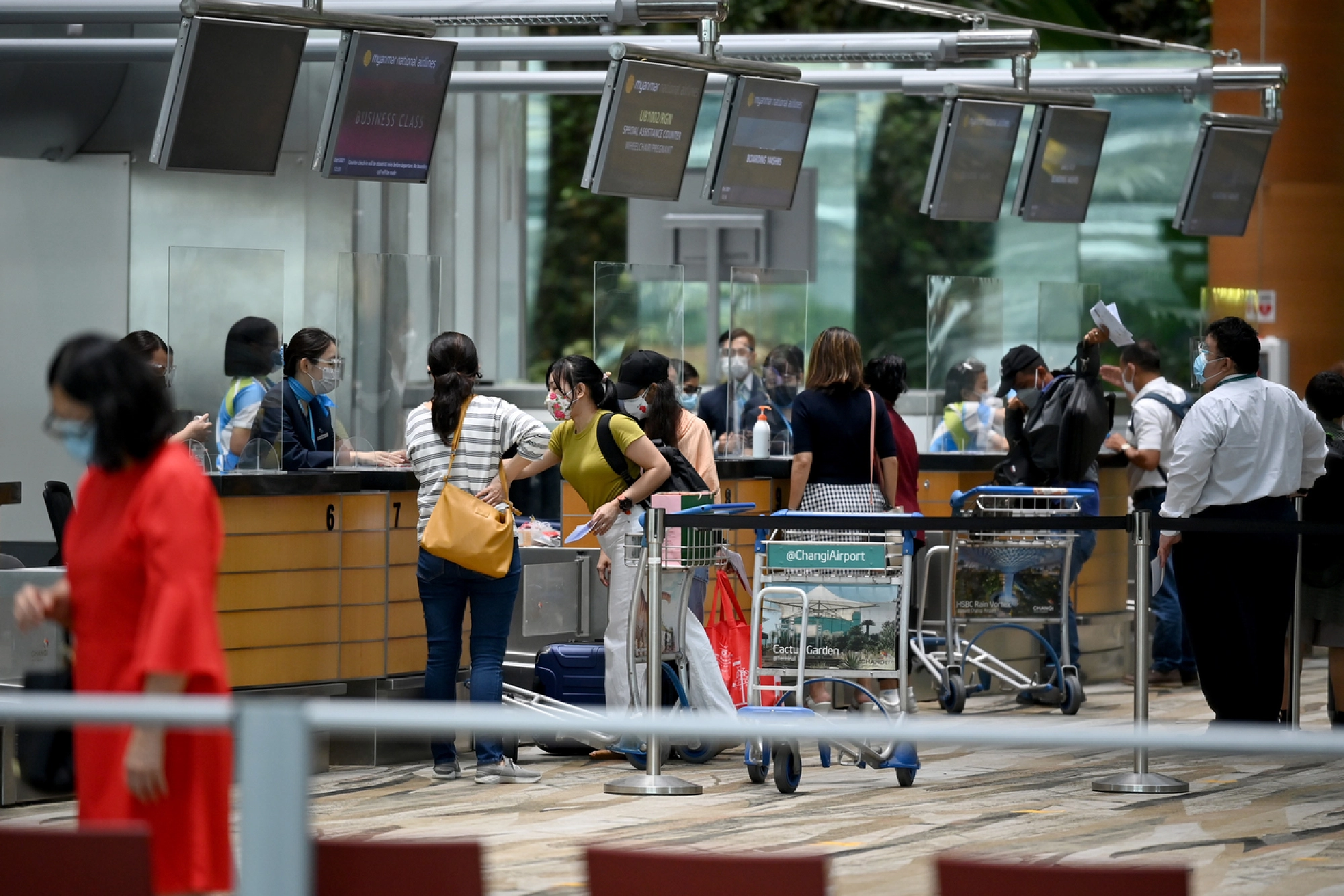 Living with Covid-19 also means reconnecting Singapore with the world and global supply chains so as to preserve Singapore's hub status, said PM Lee. ST PHOTO: LIM YAOHUI