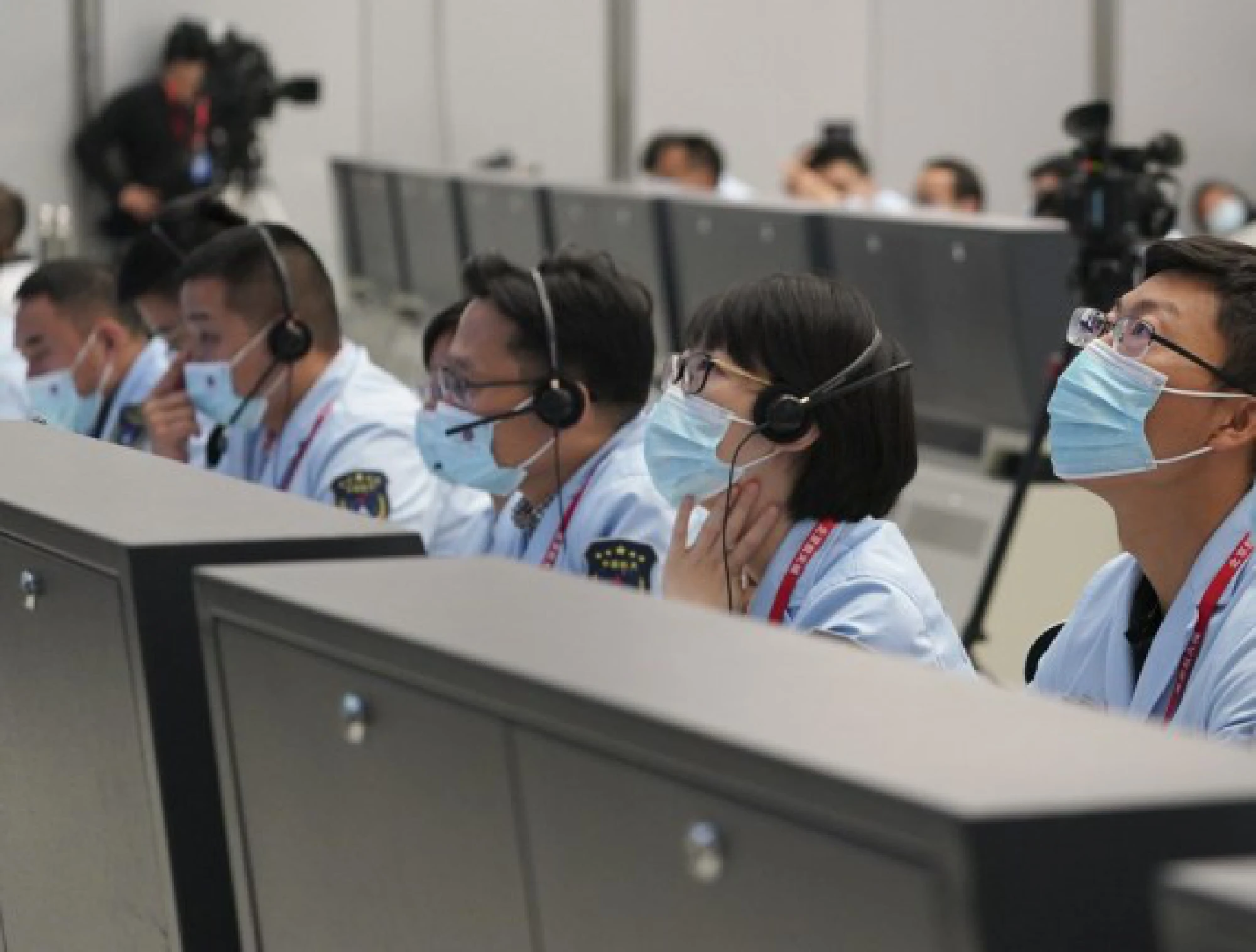 Technical personnel monitor China's Shenzhou-13 crewed spaceship docking with the radial port of the space station core module Tianhe at Beijing Aerospace Control Center in Beijing, capital of China, Oct. 16, 2021. (Xinhua/Tian Dingyu)