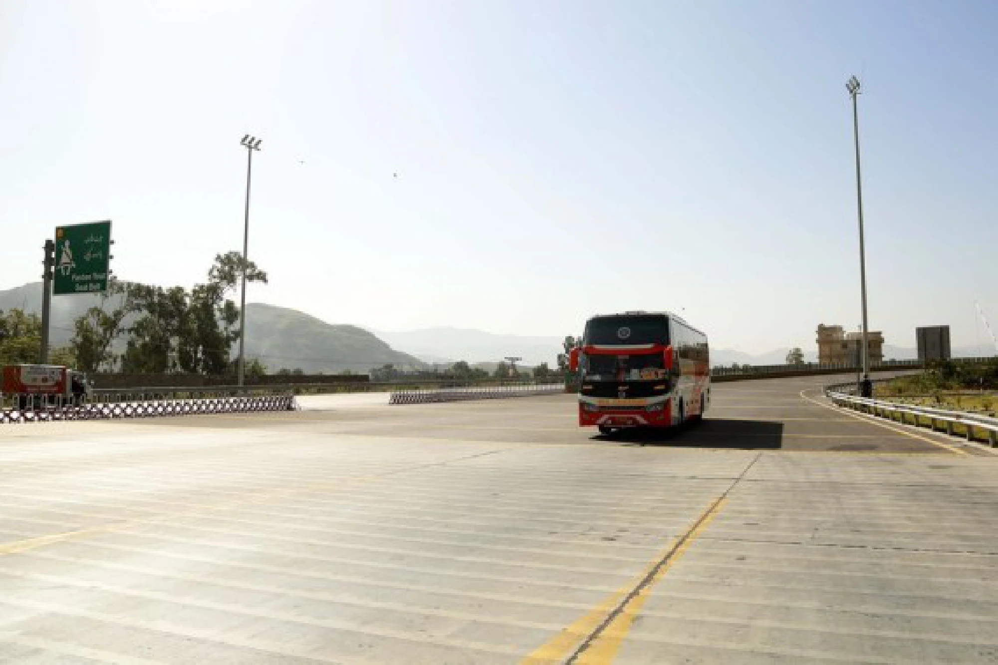 A passenger bus moves on Havelian to Thakot highway in northwest Pakistan's Havelian on Oct. 7, 2021. The road is one of CPEC's early harvest projects. (Xinhua/Ahmad Kamal)