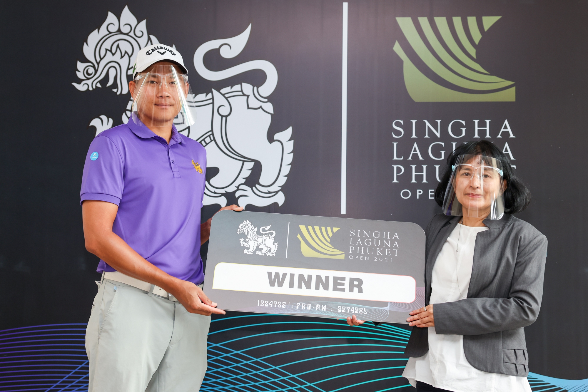 Miss Nanthasiri Ronnasiri - Director of Tourism Authority of Thailand Phuket Office – congratulating the winning team in the Pro-Am event - Singha Laguna Phuket Open 2021 at the Laguna Golf Club, Phuket.  