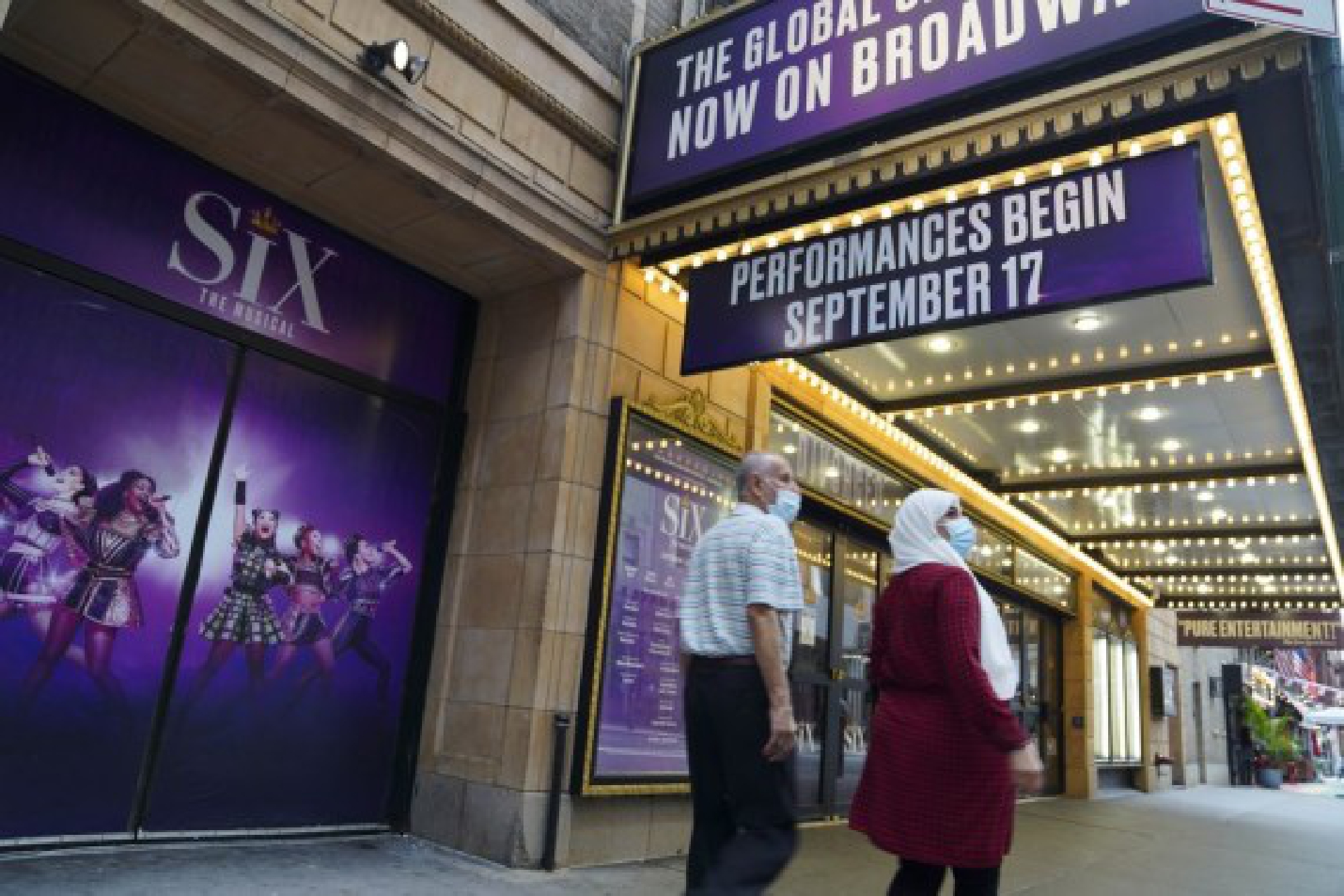 Pedestrians walk past a broadway theater in New York, the United States, July 2, 2021. (Xinhua/Wang Ying)