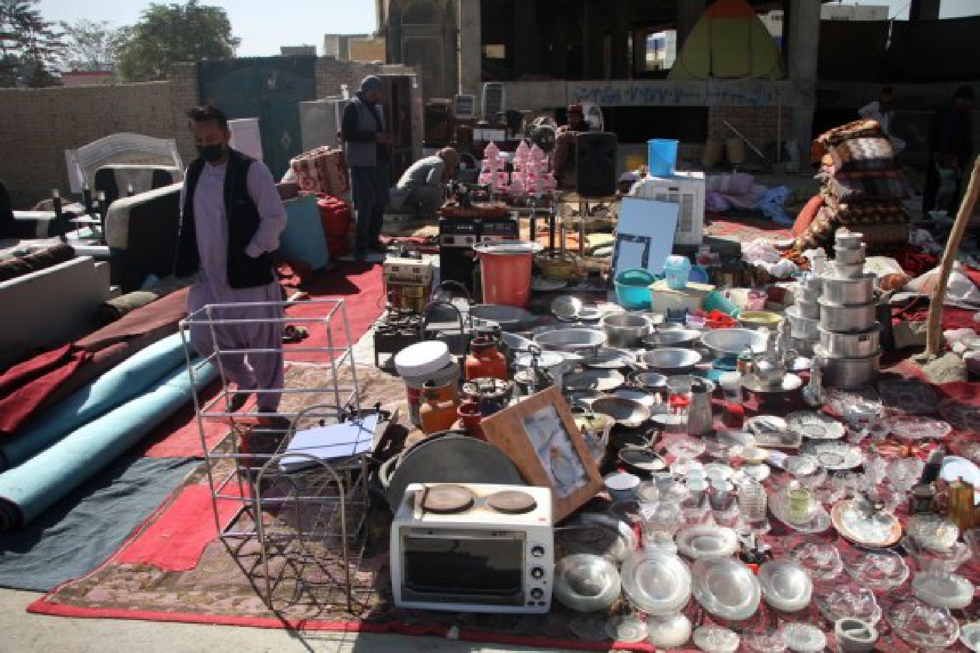 Second-hand goods are for sale at a market in Kabul, capital of Afghanistan, on Oct. 13, 2021. (Photo by Saifurahman Safi/Xinhua)