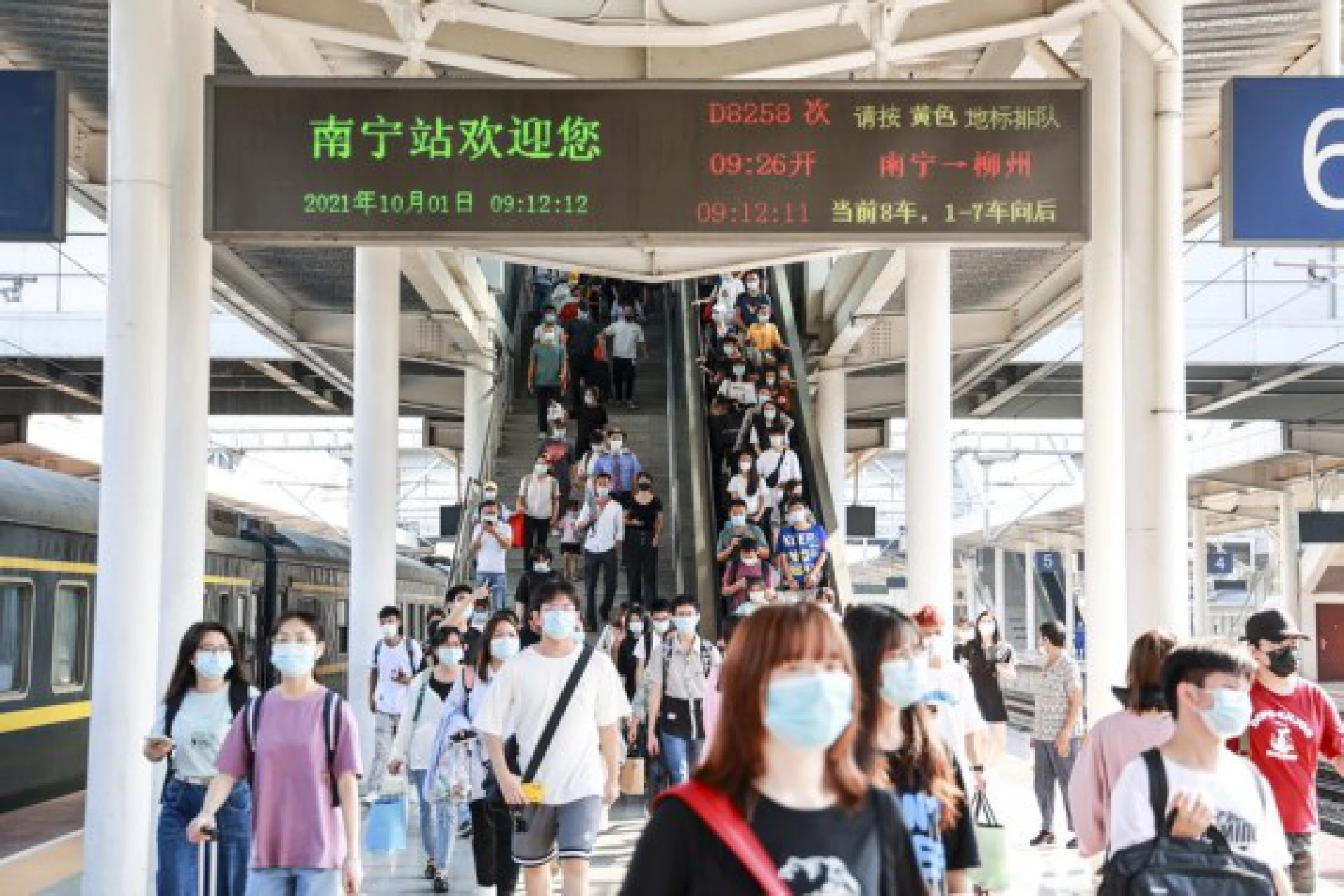  Passengers are seen at the Nanning Railway Station in Nanning, south China's Guangxi Zhuang Autonomous Region, Oct. 1, 2021. (Photo by Zhao Shilin/Xinhua)