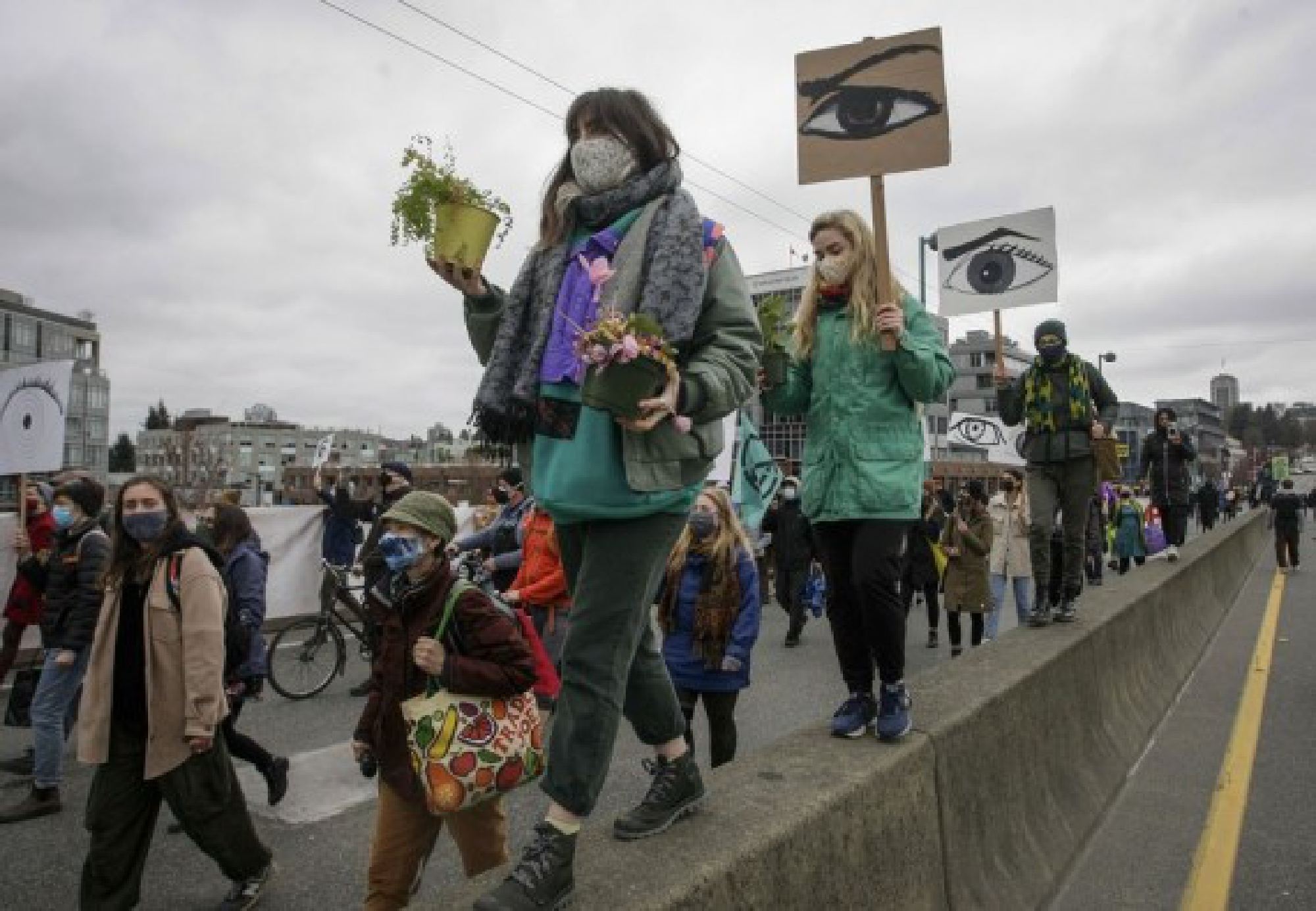 People march during a climate change protest in Vancouver, British Columbia, Canada, on March 27, 2021. (Xinhua/Liang Sen)