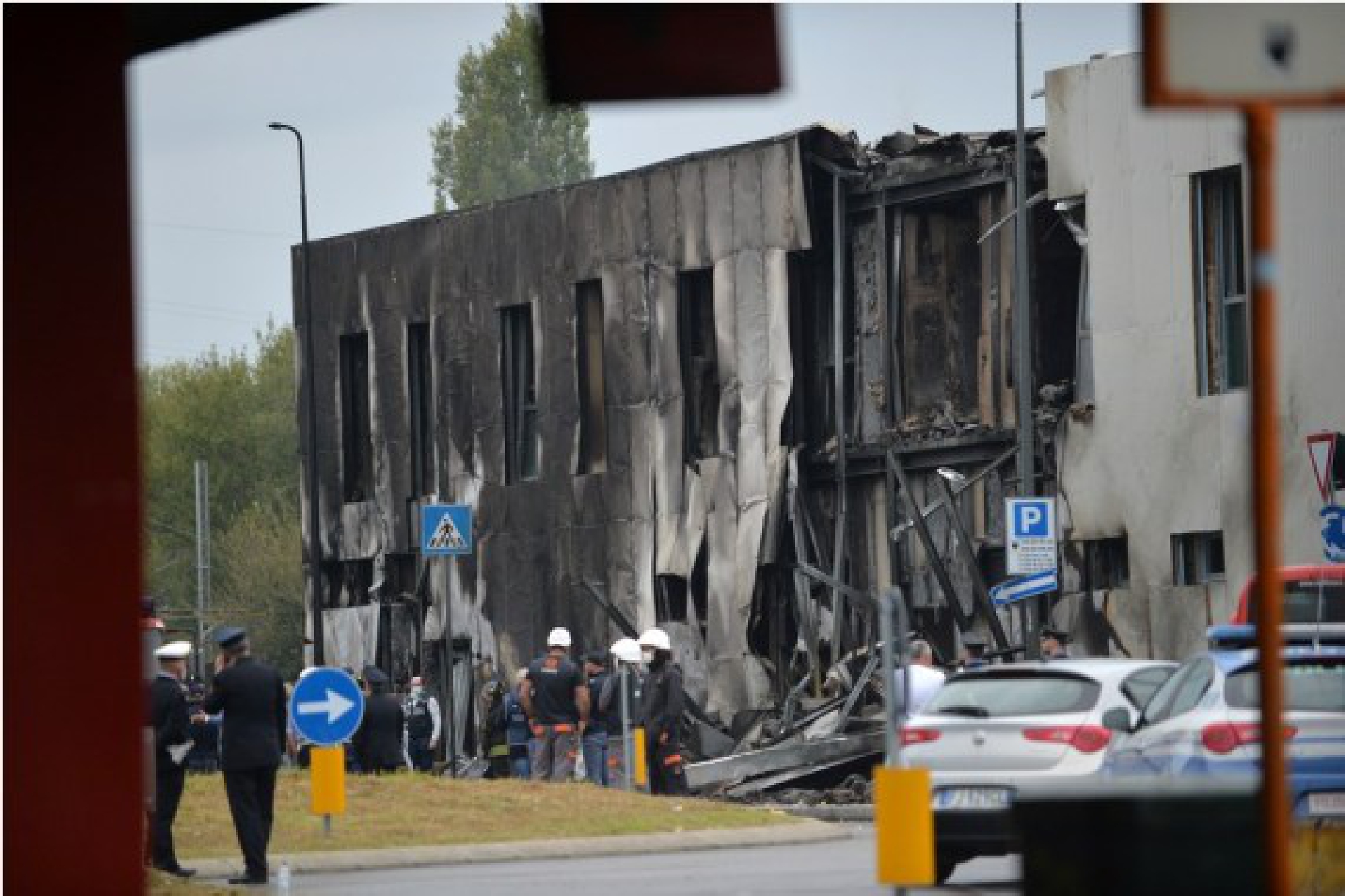 Emergency staff members work on the site of a plane crash in Milan, Italy, Oct. 3, 2021. (Str/Xinhua)
