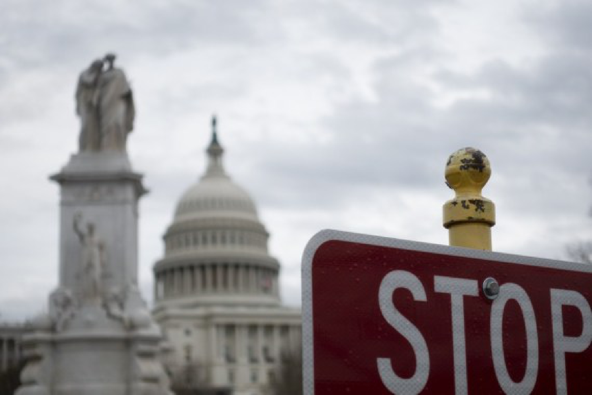 The Capitol and a stop sign are seen in Washington D.C., the United States, on Feb. 13, 2020. (Xinhua/Liu Jie)