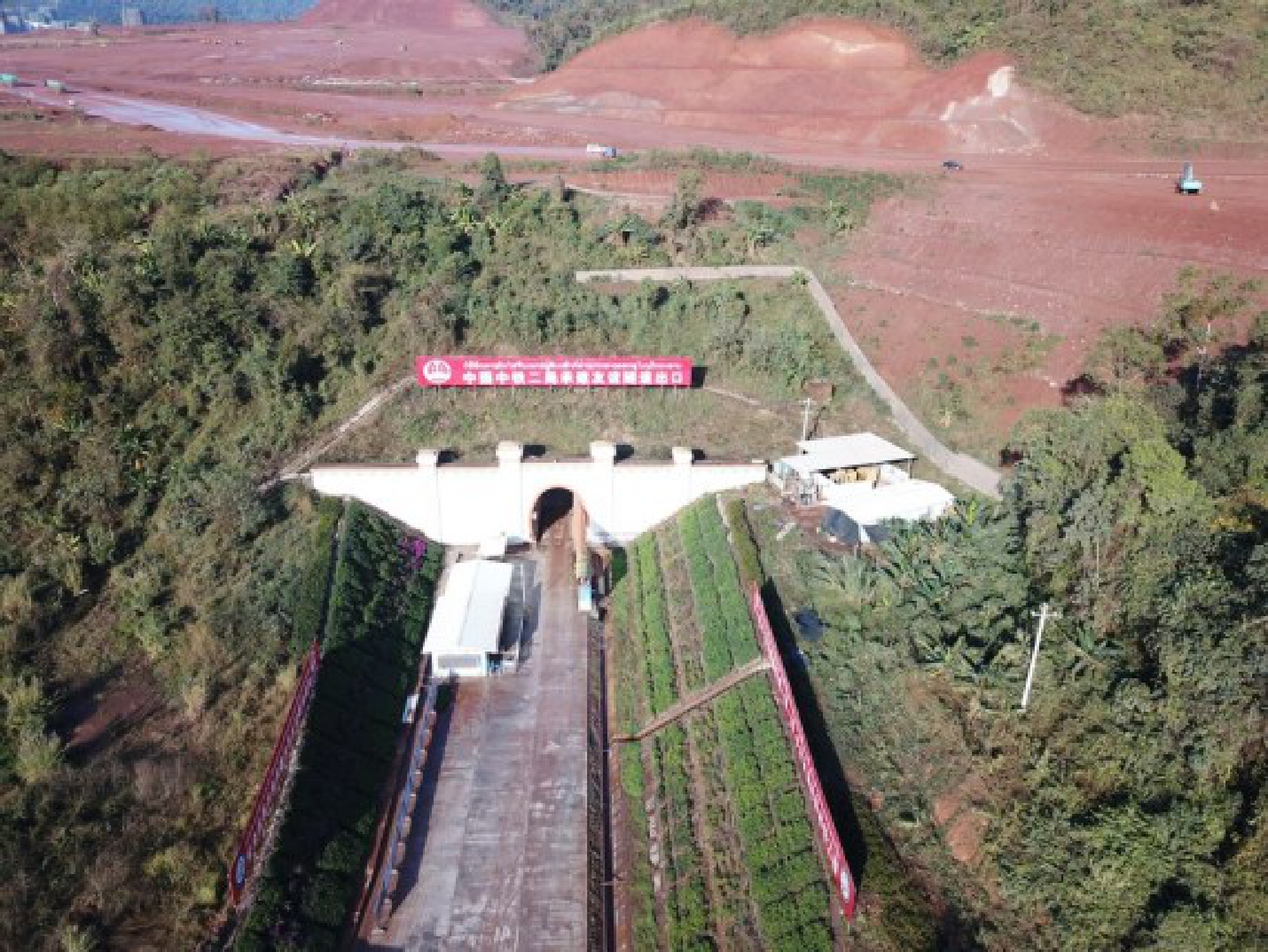 Aerial photo taken on Dec. 29, 2019 shows the exit of the Friendship Tunnel of the China-Laos railway in northern Laos. (CREC-2/Handout via Xinhua)