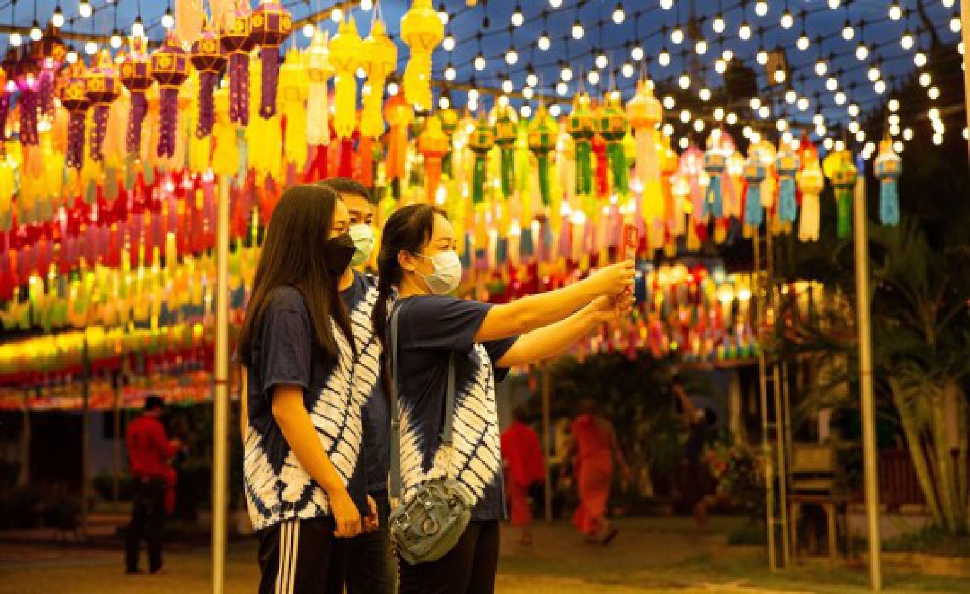 Tourists take selfies at the Wat Phra That Hariphunchai in Lamphun, Thailand, Oct. 25, 2021. (Xinhua/Wang Teng)