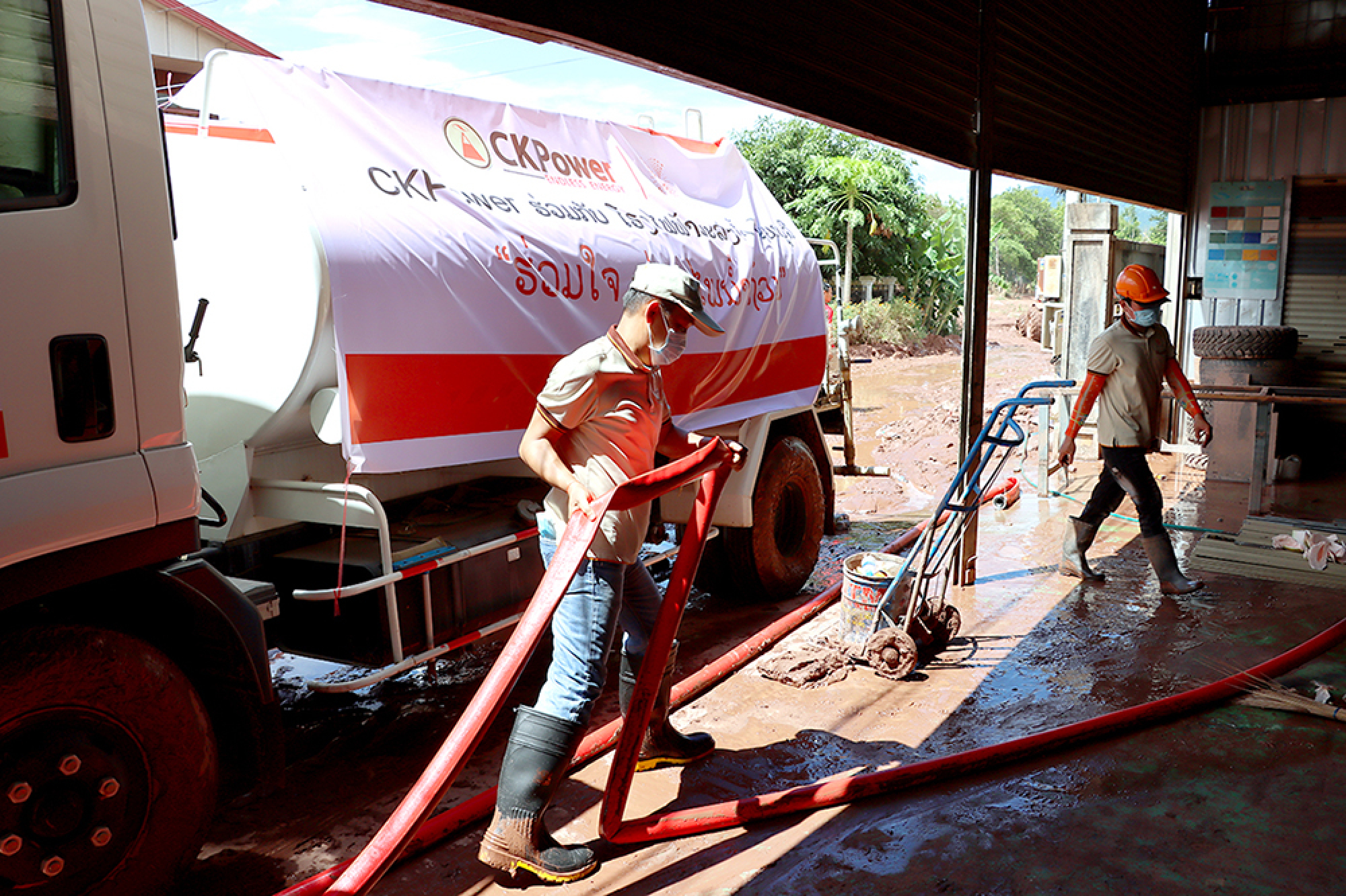 Water trucks aid to flood-stricken communities hit by tropical storm Koguma in the Lao PDR