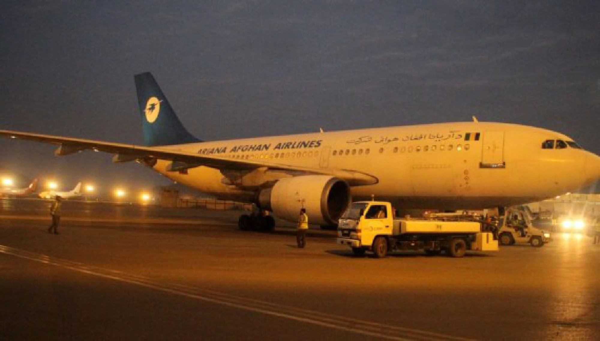 Airport employees unload emergency supplies donated by China during a handover ceremony in Kabul, capital of Afghanistan, Sept. 29, 2021. A batch of emergency supplies donated by China arrived at Afghanistan's Kabul International Airport on Wednesday night and was handed over to the Afghan side. (Photo by Saifurahman Safi/Xinhua)
