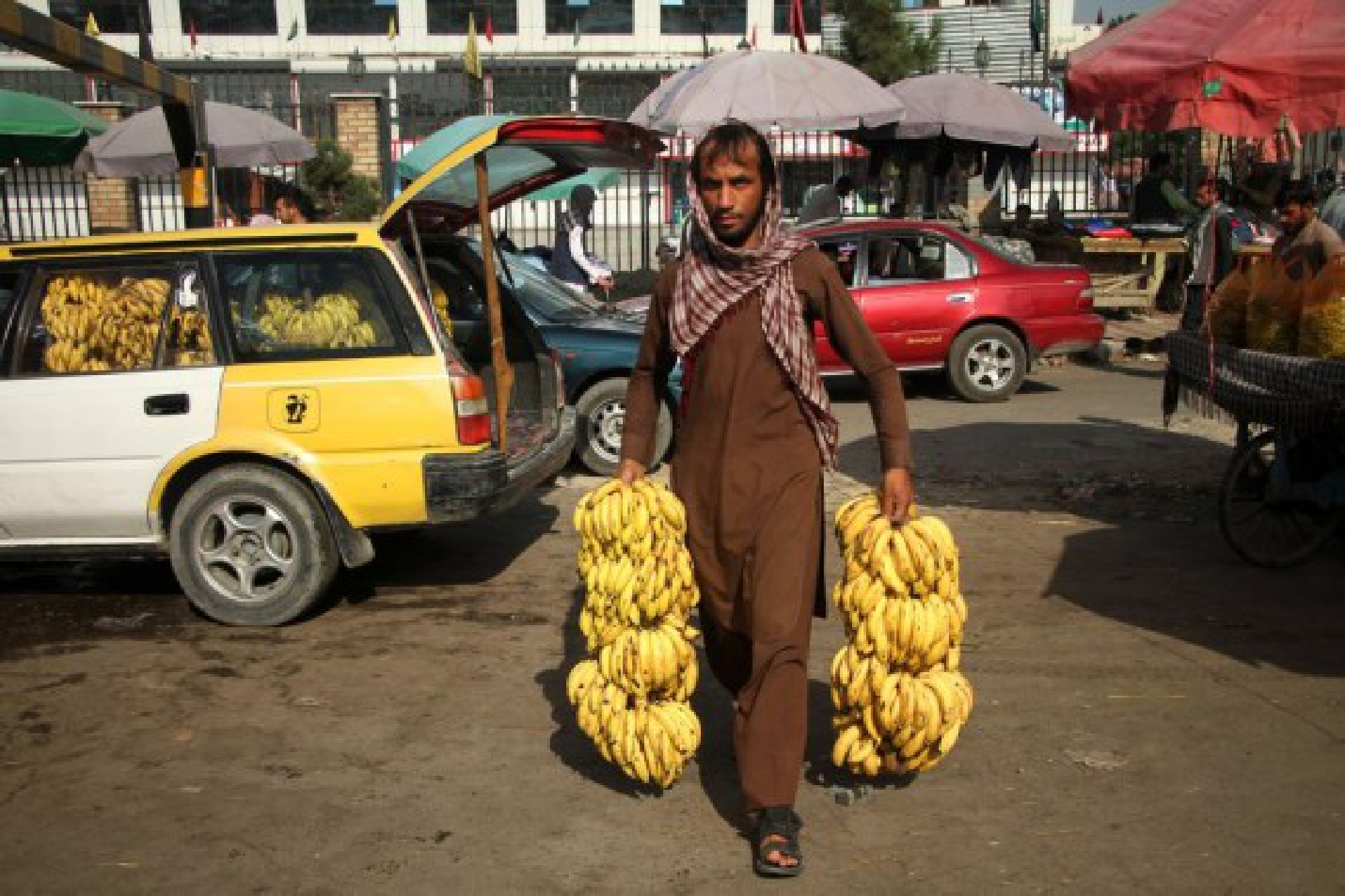 An Afghan man delivers bananas in Kabul, capital of Afghanistan, Sept. 15, 2021. (Photo by Saifurahman Safi/Xinhua)