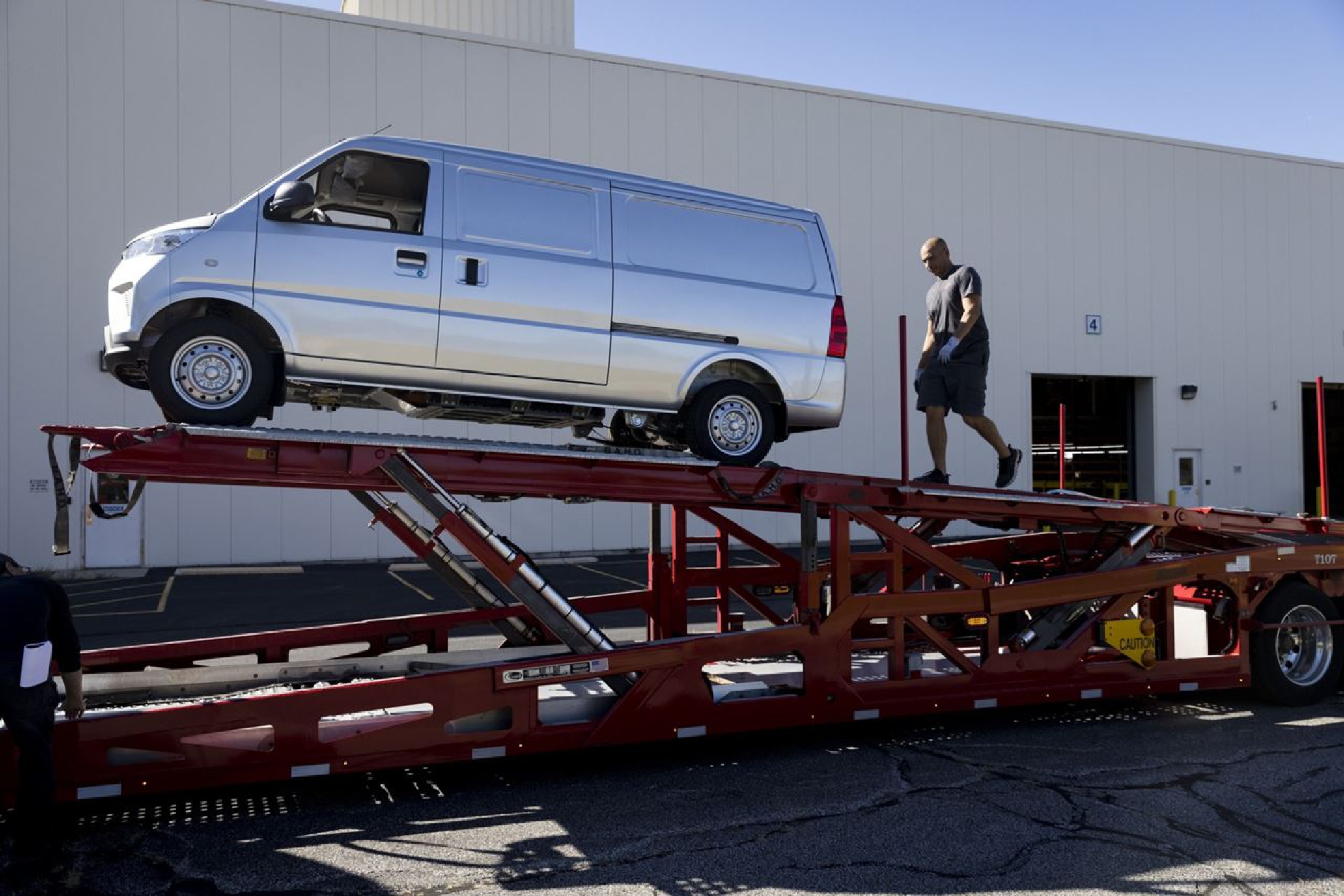An Urban Delivery electric van is loaded onto a truck outside the Electric Last Mile Solutions facility in Mishawaka, Indiana, on Sept. 28, 2021. PHOTO CREDIT: Bloomberg photo by Taylor Glasscock.