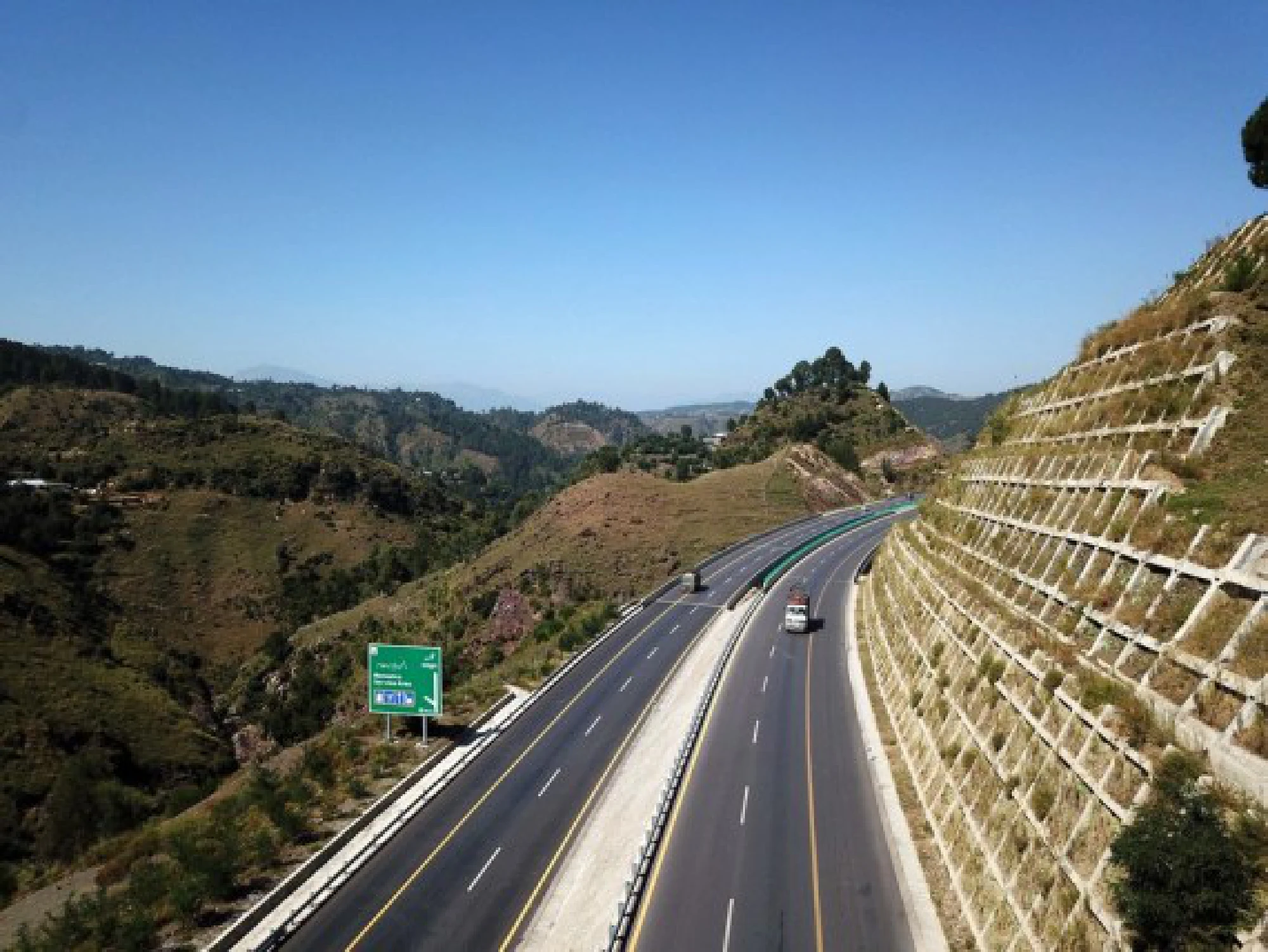 Aerial photo taken on Oct. 7, 2021 shows vehicles drive on Havelian to Thakot highway in northwest Pakistan's Havelian. The road is one of CPEC's early harvest projects. (Xinhua/Ahmad Kamal)