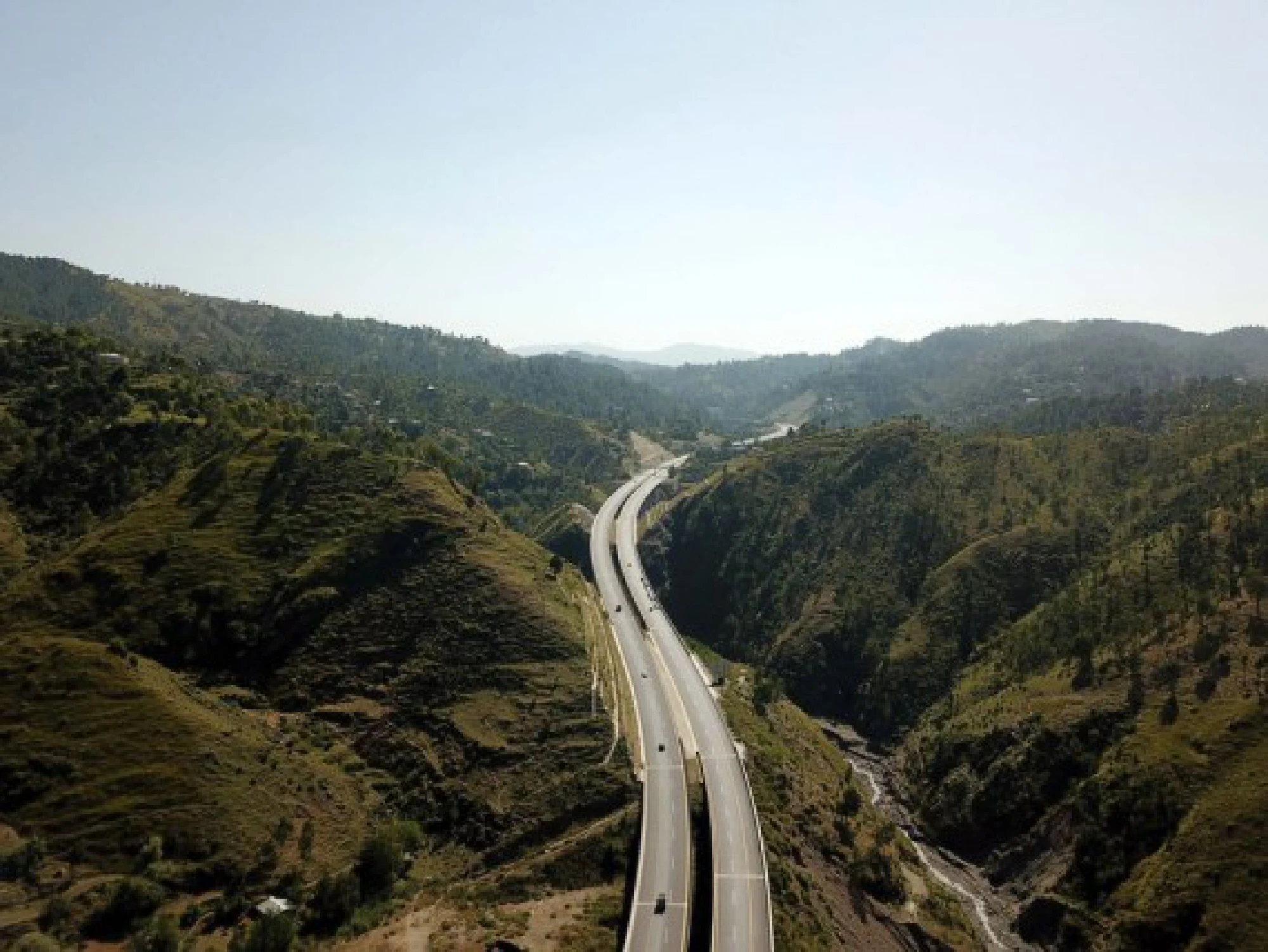 Aerial photo taken on Oct. 7, 2021 shows vehicles drive on Havelian to Thakot highway in northwest Pakistan's Havelian. (Xinhua/Ahmad Kamal)