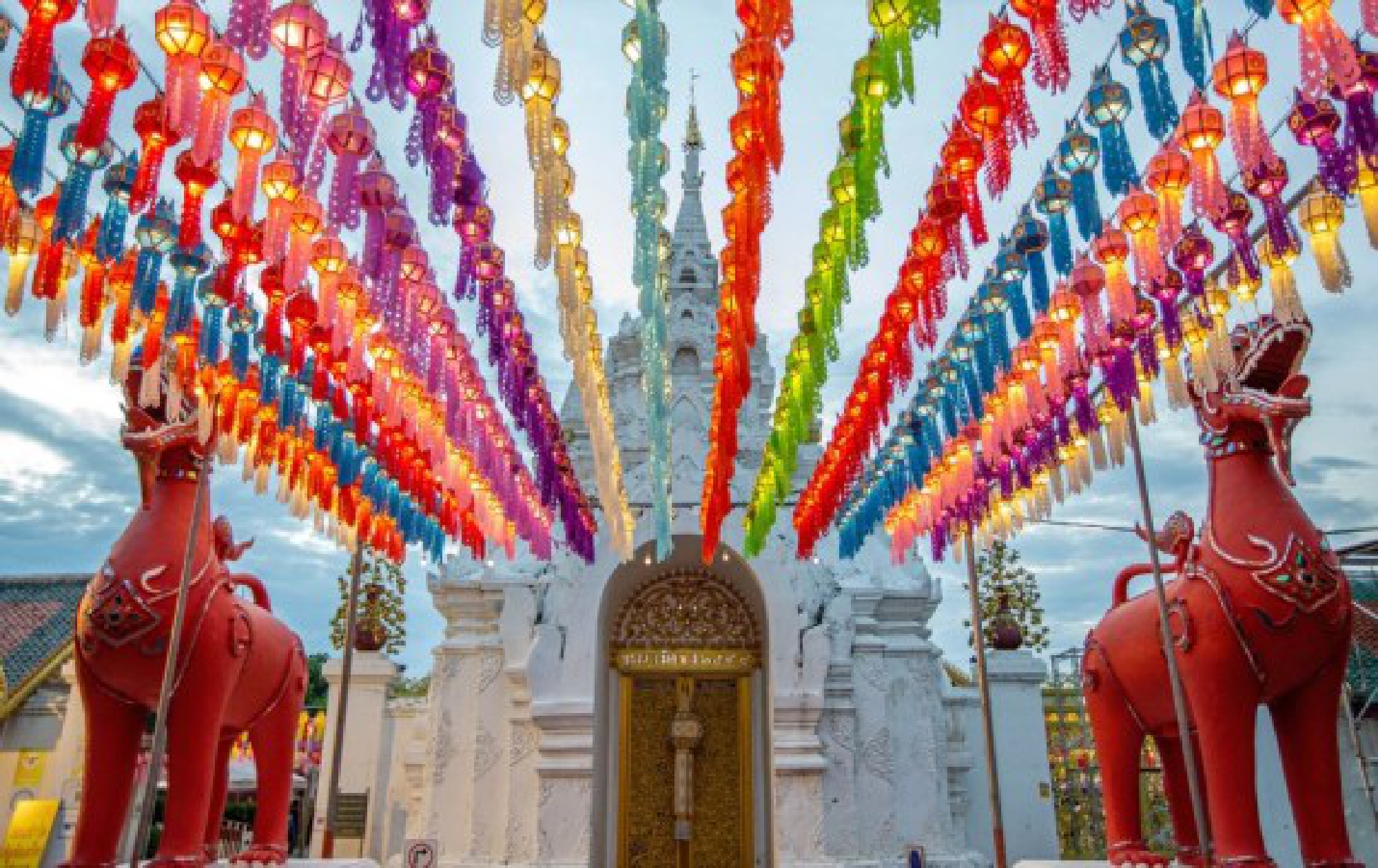 Colorful lanterns are seen at the Wat Phra That Hariphunchai in Lamphun, Thailand, Oct. 25, 2021. (Xinhua/Wang Teng)