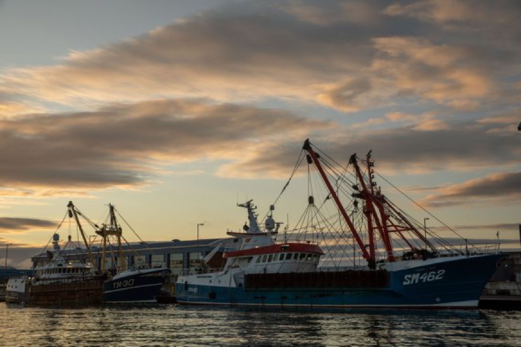 Photo taken on Oct. 11, 2020 shows British boats during sunrise at Shoreham Docks, Britain.   (Photo by Tim Ireland/Xinhua)