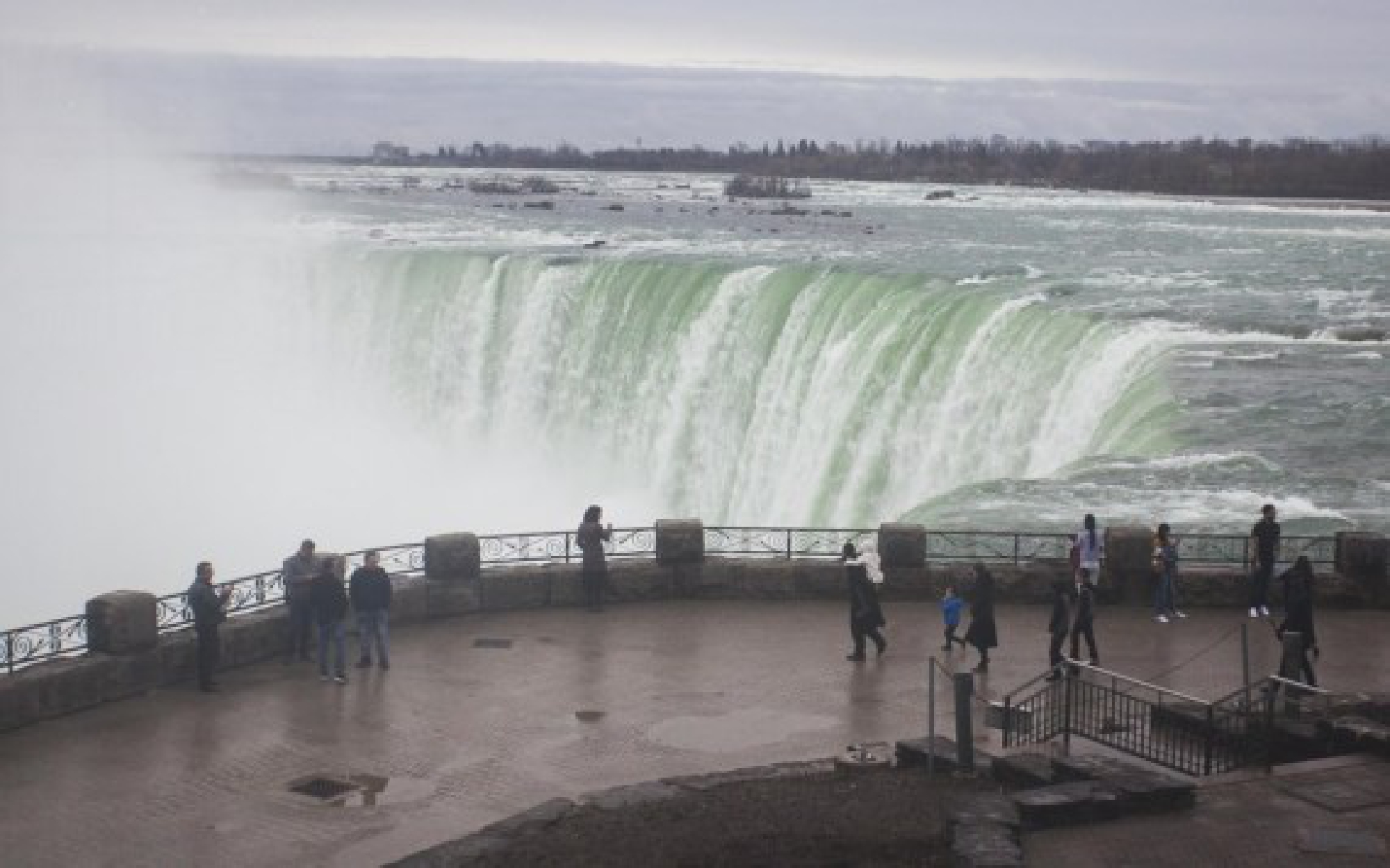 Visitors are seen at the Canadian side of Niagara Falls, Ontario, Canada, on March 31, 2021. (Photo by Zou Zheng/Xinhua)