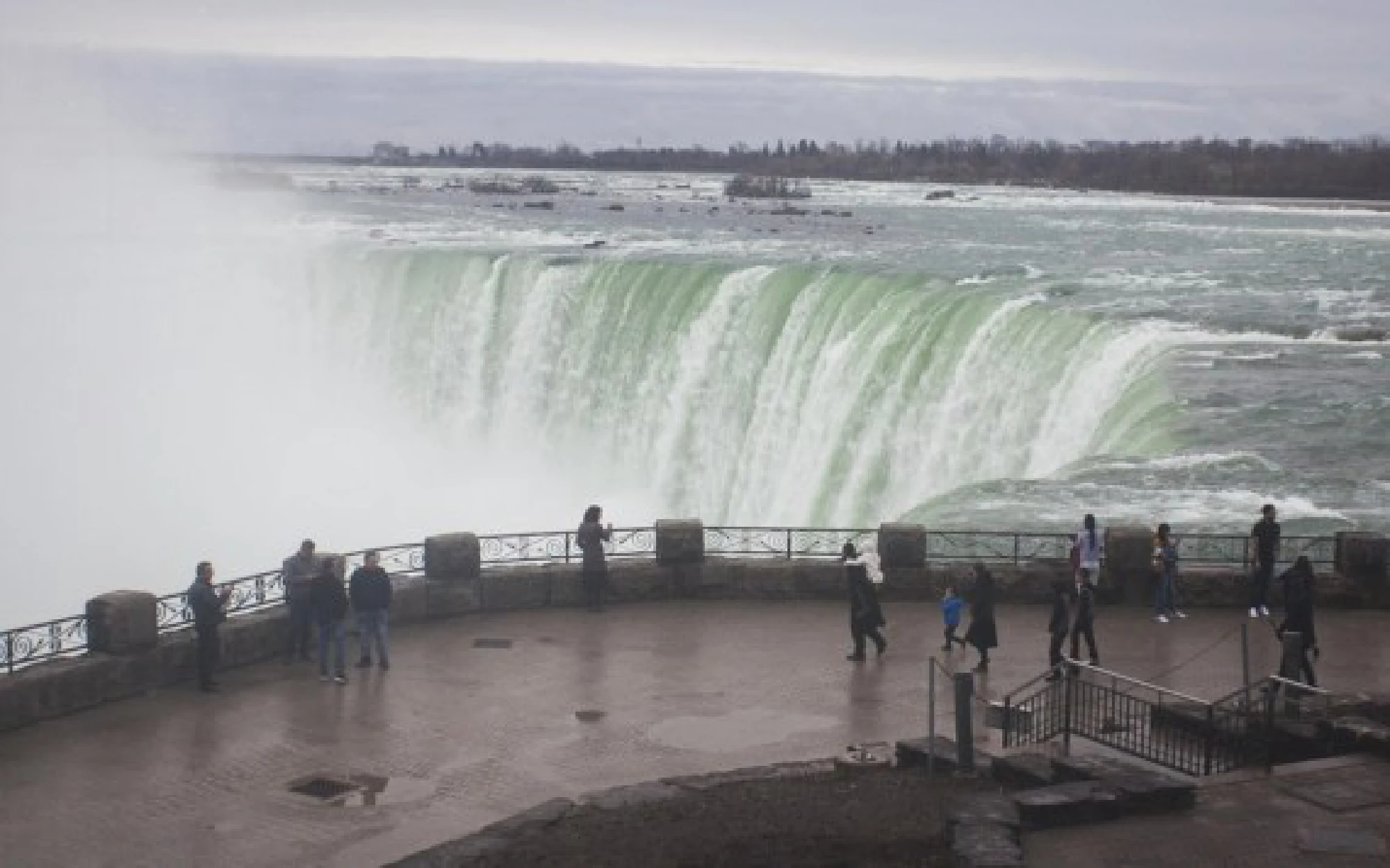 Visitors are seen at the Canadian side of Niagara Falls, Ontario, Canada, on March 31, 2021. (Photo by Zou Zheng/Xinhua)