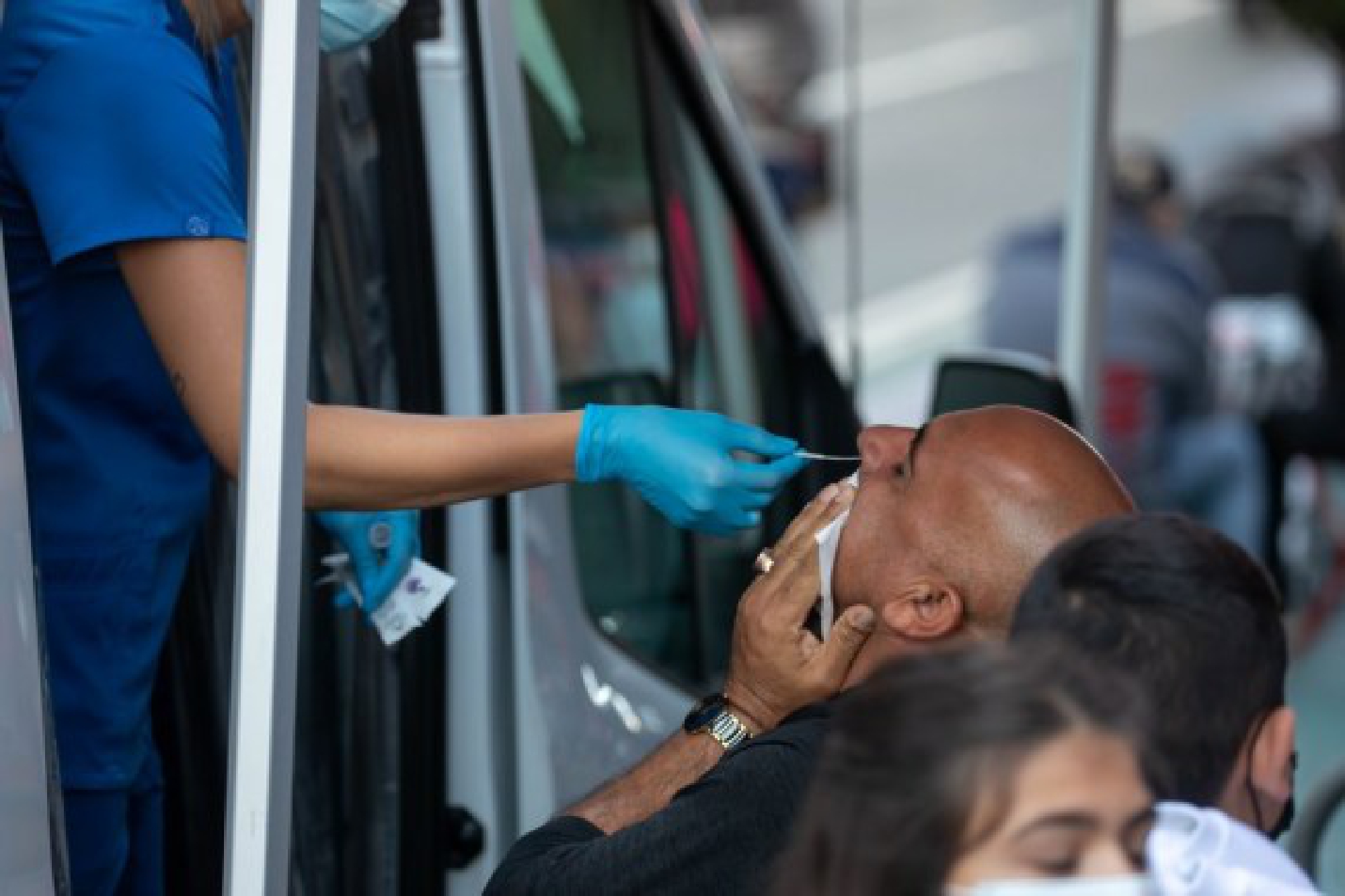 A man takes a COVID-19 test at a testing van in Times Square in New York, the United States, Oct. 2, 2021. (Photo by Michael Nagle/Xinhua)