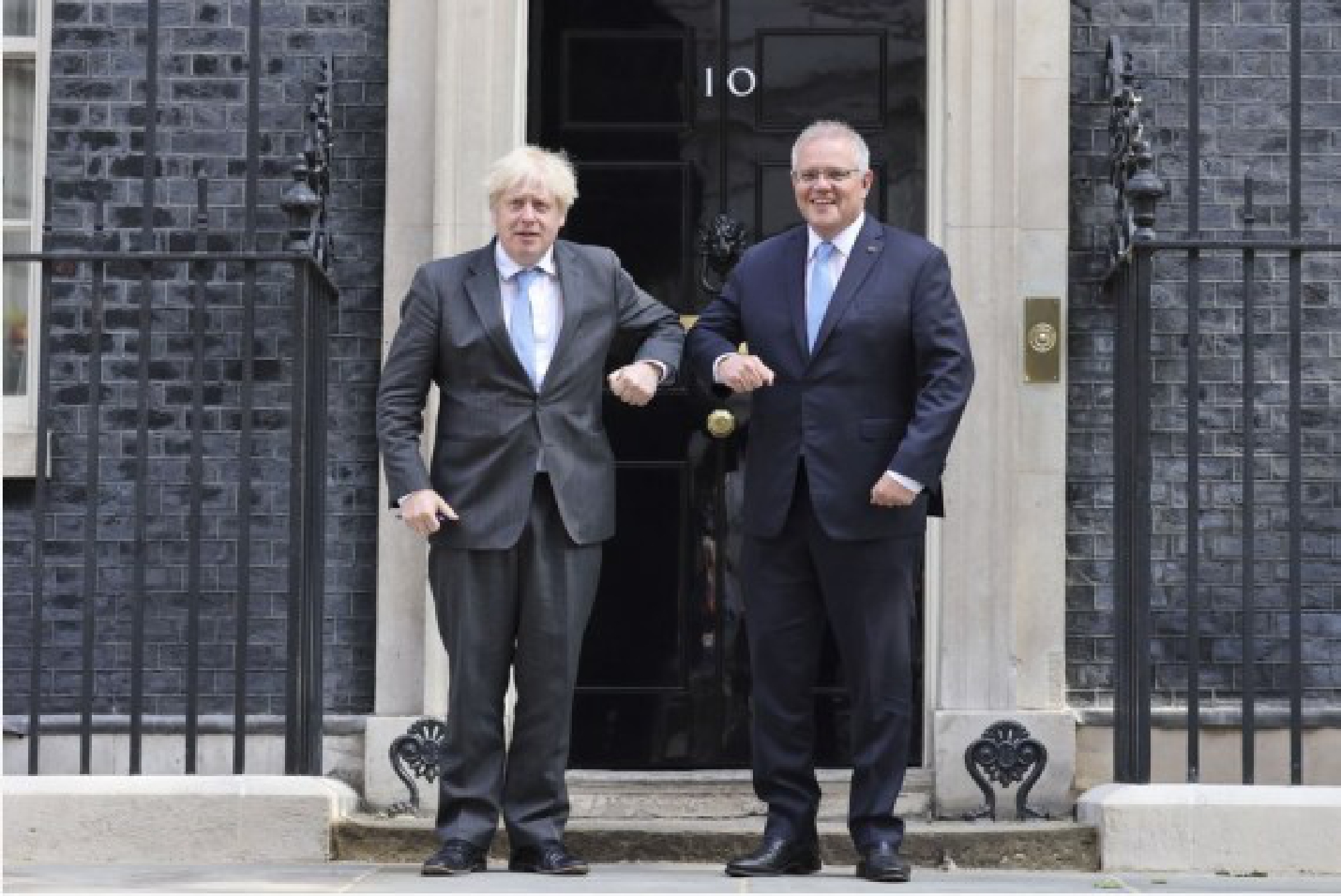  British Prime Minister Boris Johnson (L) greets Australian Prime Minister Scott Morrison in front of 10 Downing Street, in London, Britain, on June 15, 2021.(Tim Hammond/No. 10 Downing Street/Handout via Xinhua)
