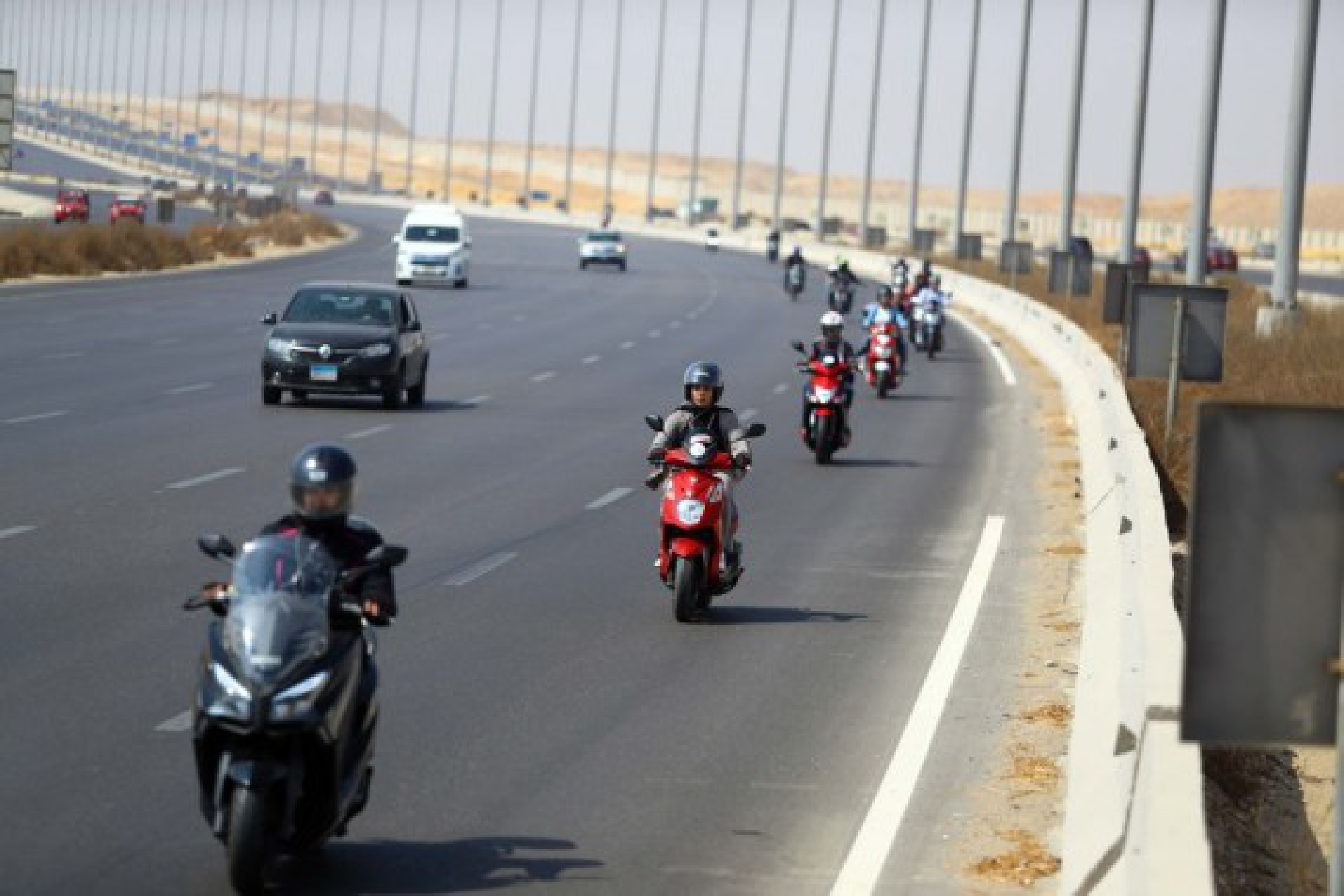 Dozens of Egyptian biker women dotted a highway in the capital Cairo to encourage more women to take the plunge and get on two wheels. (Xinhua/Ahmed Gomaa)