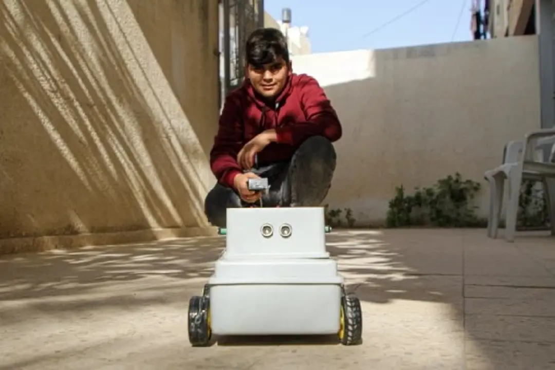 Mohammed al-Halaq works on his inventions at home in the southern Gaza Strip city of Khan Younis, on Nov. 15, 2021. (Xinhua/Rizek Abdeljawad)