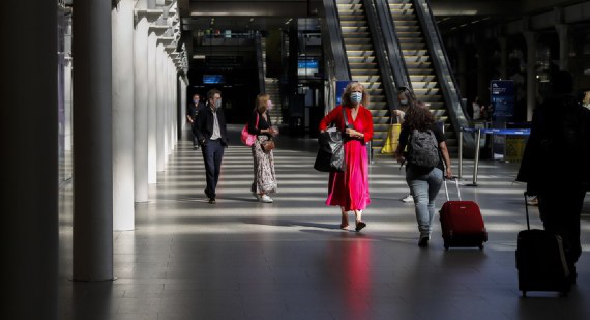 Passengers walk at St. Pancras International Station in London, Britain, on July 29, 2021. (Xinhua/Han Yan)