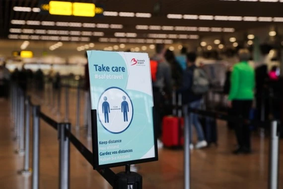 People queue up for check-in in the departure hall at the Brussels Airport in Zaventem, Belgium, July 1, 2021. (Xinhua/Zheng Huansong)