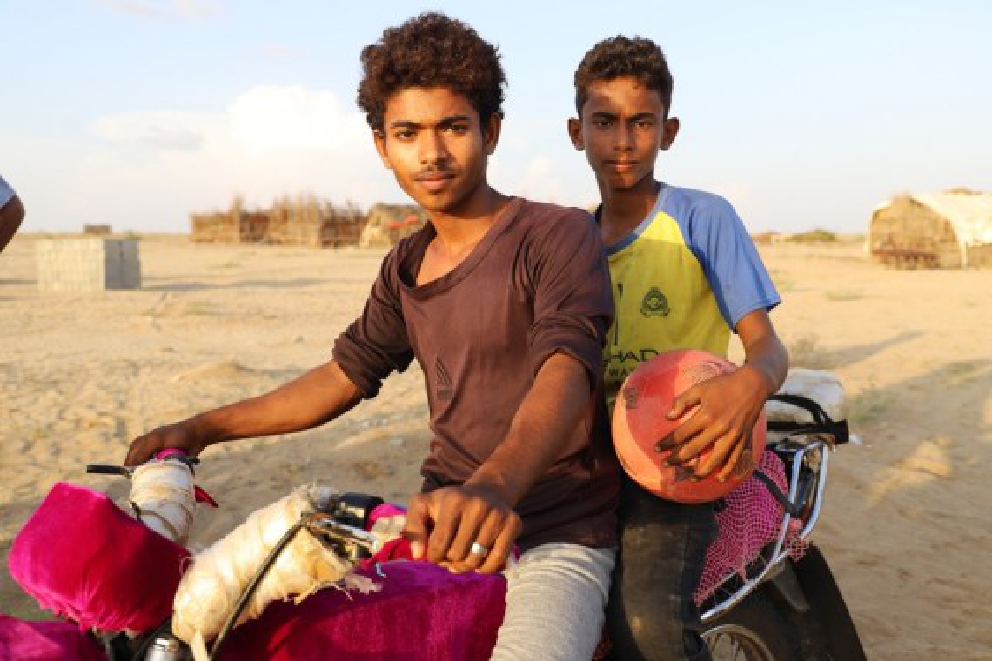 A Yemeni man buys petrol for his motorcycle from a make-shift oil station on Nov. 5, 2021 in Hajjah Province, northern Yemen. (Photo by Mohammed Al-Wafi/Xinhua)