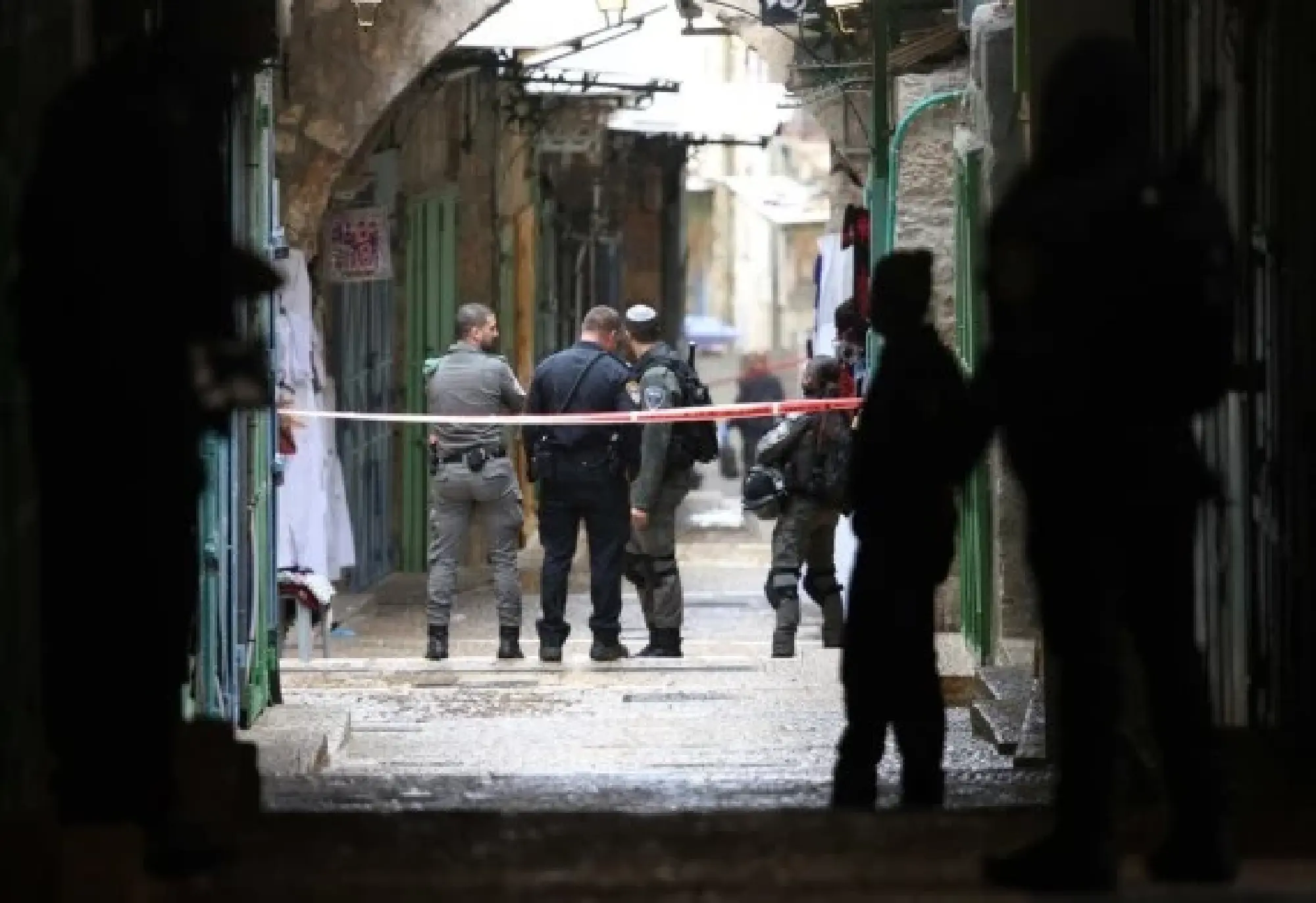 Israeli police officials gather near the site of a shooting incident in Jerusalem's Old City on Nov. 21, 2021. (Photo by Muammar Awad/Xinhua)