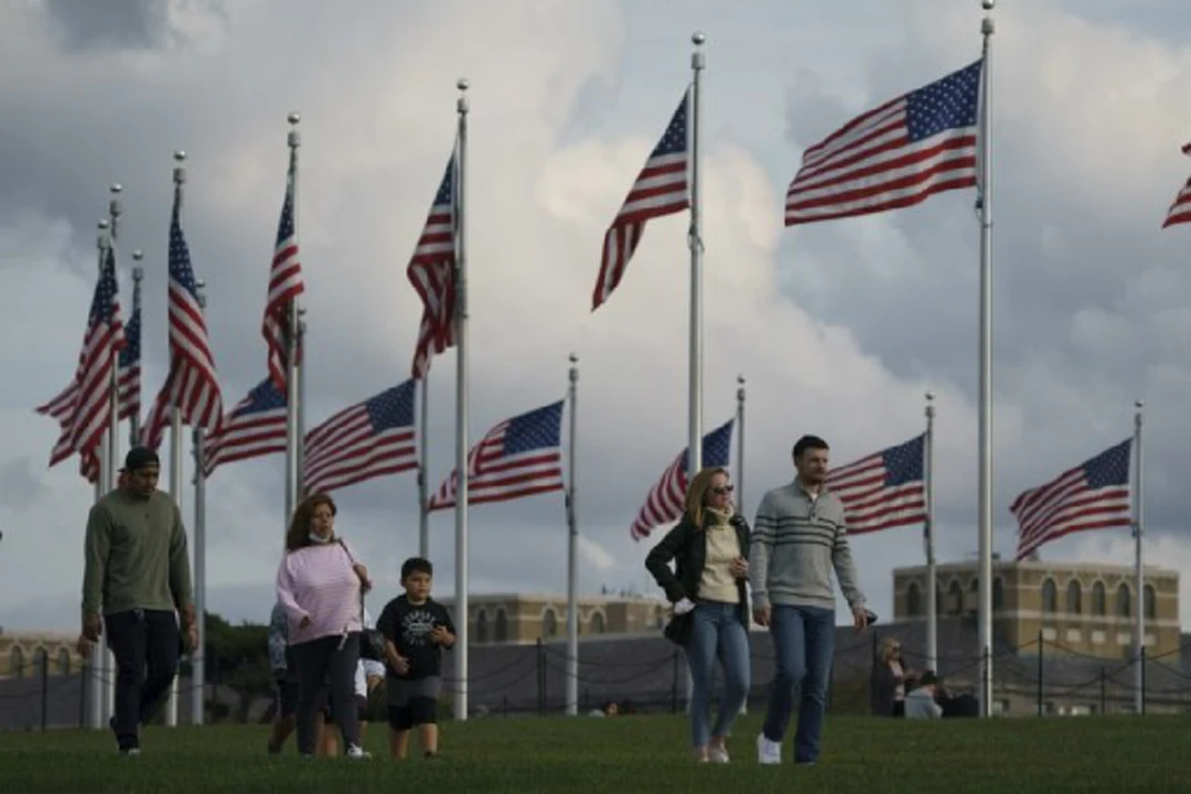 Tourists spend time on the National Mall in Washington D.C., the United States on Oct. 30, 2021, one day after the U.S. Food and Drug Administration (FDA) authorized the emergency use of the Pfizer-BioNTech COVID-19 vaccine in children 5 through 11 years of age. (Photo by Ting Shen/Xinhua)