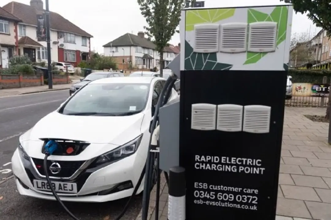An electric car is seen at a charging point in London, Britain, Oct. 26, 2021. (Photo by Ray Tang/Xinhua)