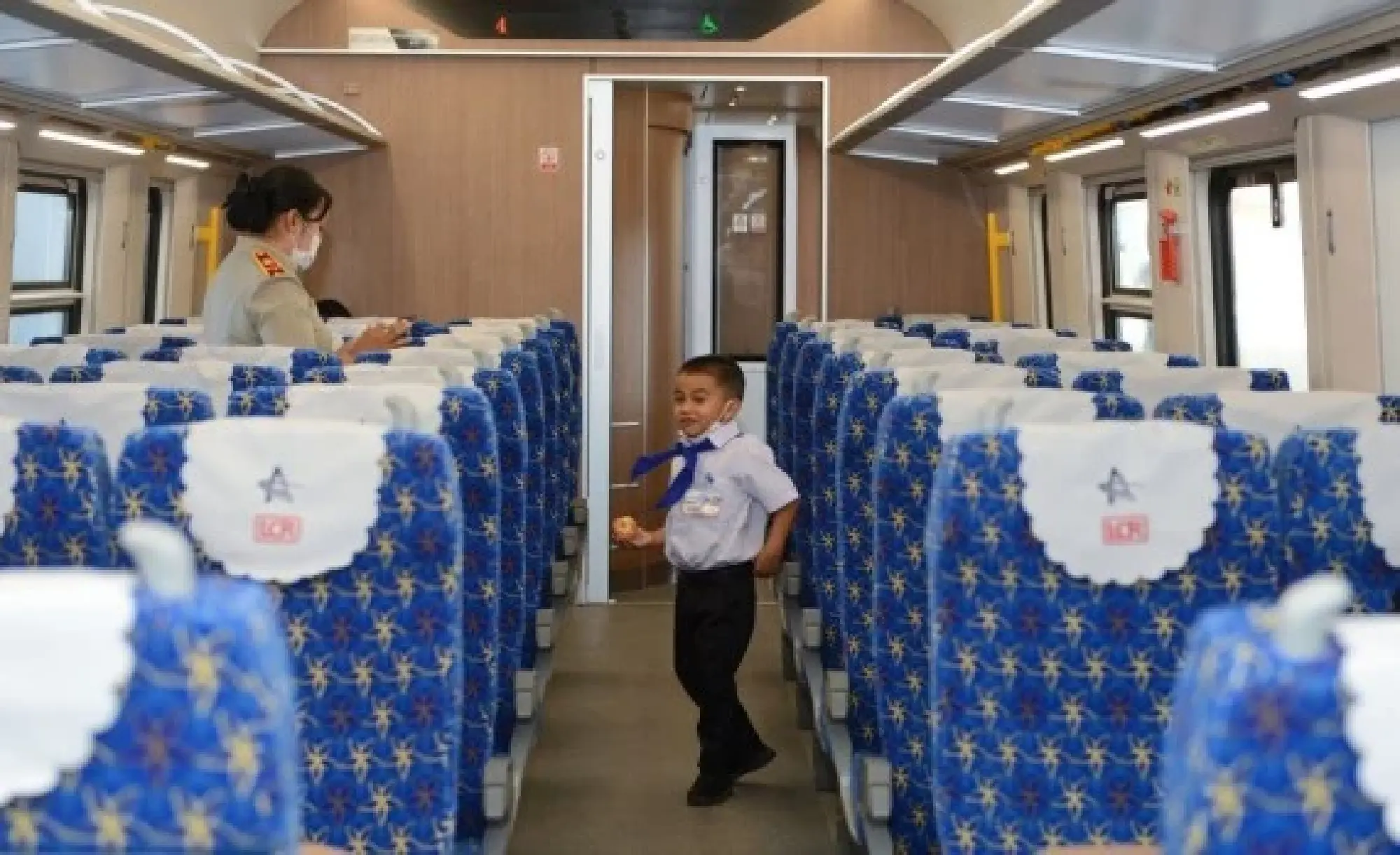 A student from the China-Laos Friendship Nongping Primary School is seen on the Lane Xang EMU train of the China-Laos Railway on Dec. 3, 2021. (Photo by Alan Liu/Xinhua)