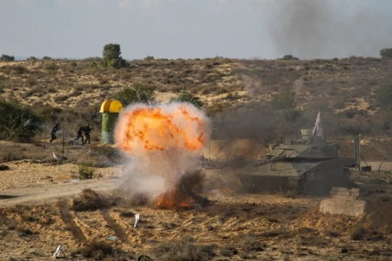 Palestinian militants take part in a military maneuver in the southern Gaza Strip city of Rafah, on Dec. 29, 2021. (Photo by Rizek Abdeljawad/Xinhua)