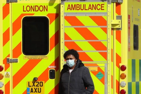  A woman walks past an ambulance at the Royal London Hospital in London, Britain, on April 9, 2021. (Photo by Tim Ireland/Xinhua)