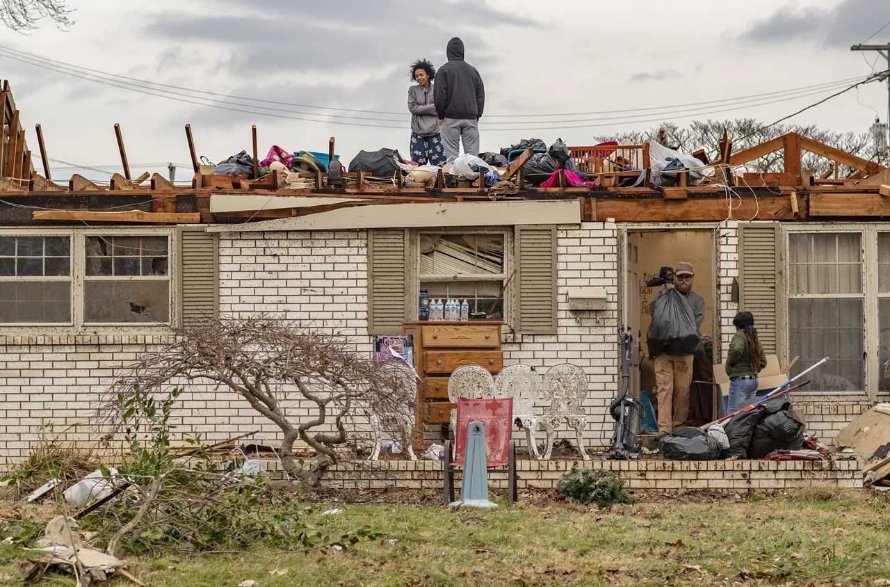Scores killed as tornadoes rake six states