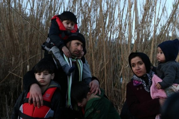 Photo taken on March 2, 2020 shows refugees and migrants coming off a boat after arrival at Skala Sikaminias, in the island of Lesvos, Greece. (Xinhua/Marios Lolos)