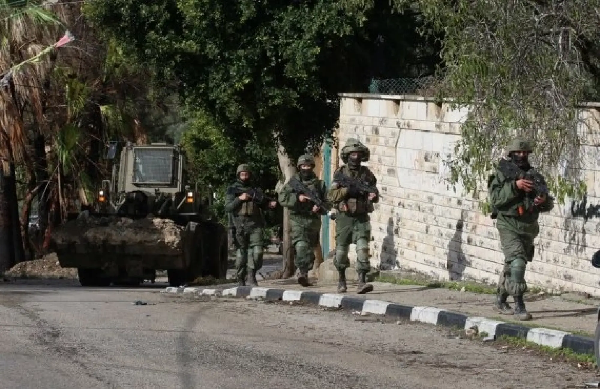 Israeli soldiers and a bulldozer are seen in the village of Burqa, north of the West Bank city of Nablus, Dec. 23, 2021.  (Photo by Nidal Eshtayeh/Xinhua)
