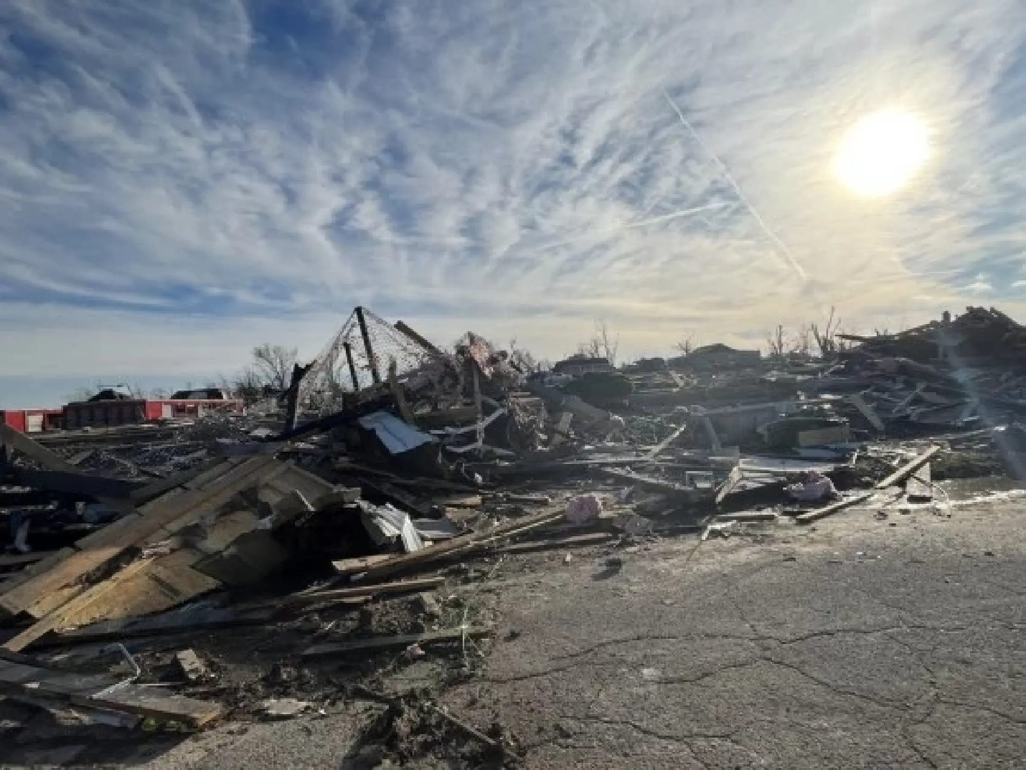 Photo taken on Dec. 11, 2021 shows houses damaged in tornadoes in Mayfield, Kentucky, the United States. (Photo by Caromirna Sanchez/Xinhua)