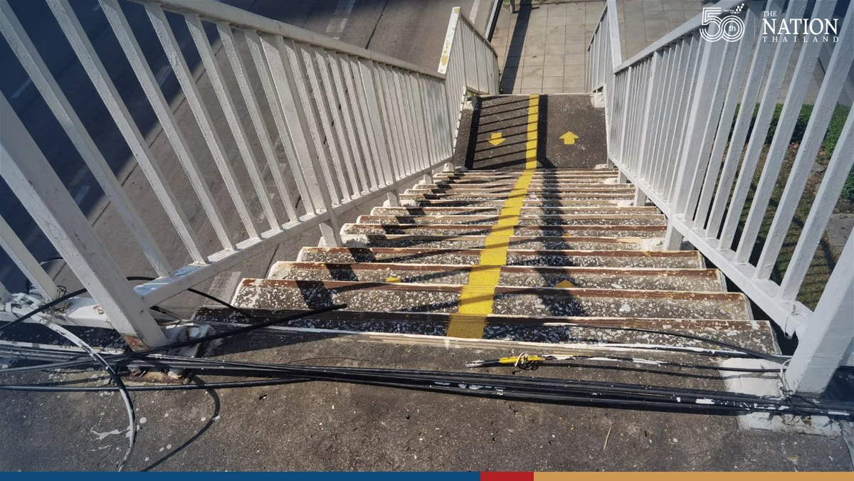 Thonburi pedestrian bridge cluttered with internet cables, not live wires