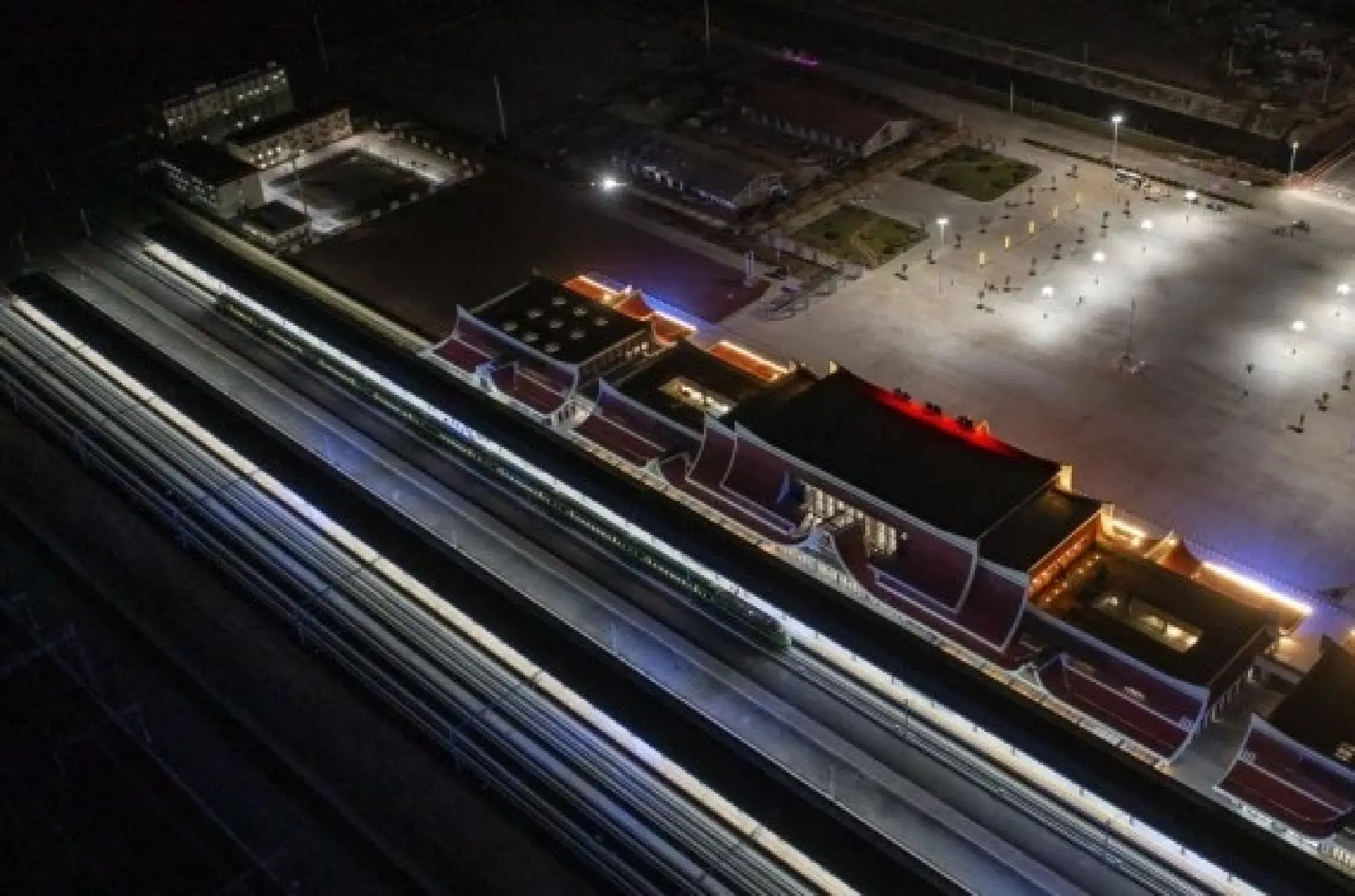 Aerial photo shows an electric multiple unit (EMU) train of the China-Laos Railway arriving at the border town of Mohan in southwest China's Yunnan Province, Dec. 3, 2021. The China-Laos Railway started operation on Friday. (Xinhua/Jiang Wenyao)