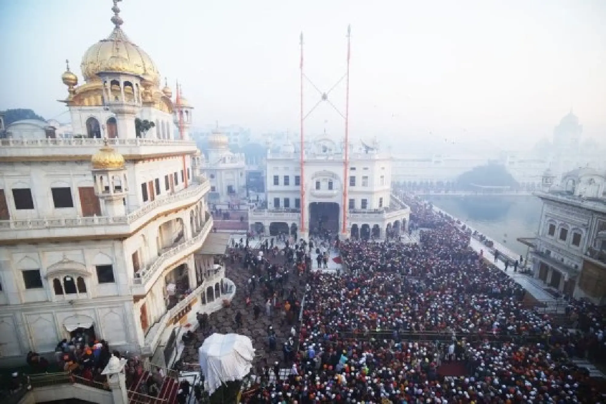 Devotees queue to pay obeisance in the pre-dawn hours at the Golden Temple on New Year's day in Amritsar of India's northern state of Punjab, Jan. 1, 2022. (Str/Xinhua)